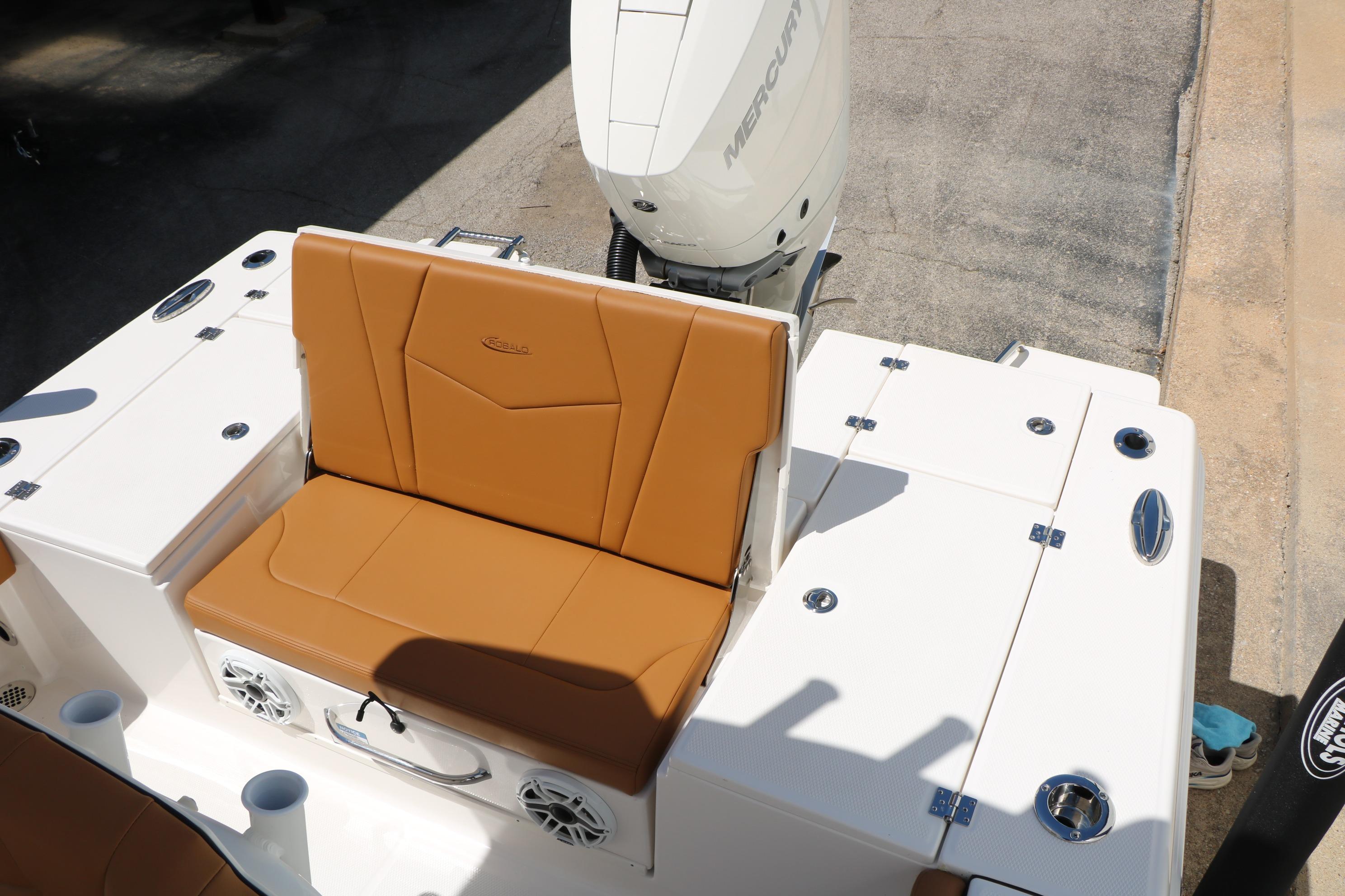 2026 Robalo 246 Cayman boat with tan seating and Mercury engine.