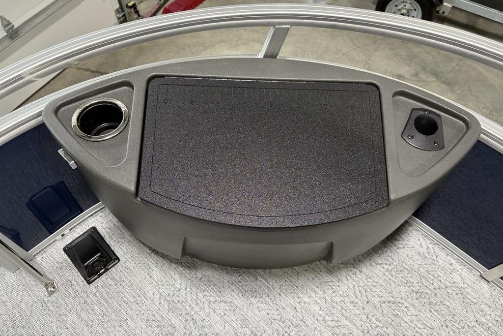 2026 Sun Tracker Bass Buggy 18 DLX boat console with cup holders and storage compartment.
