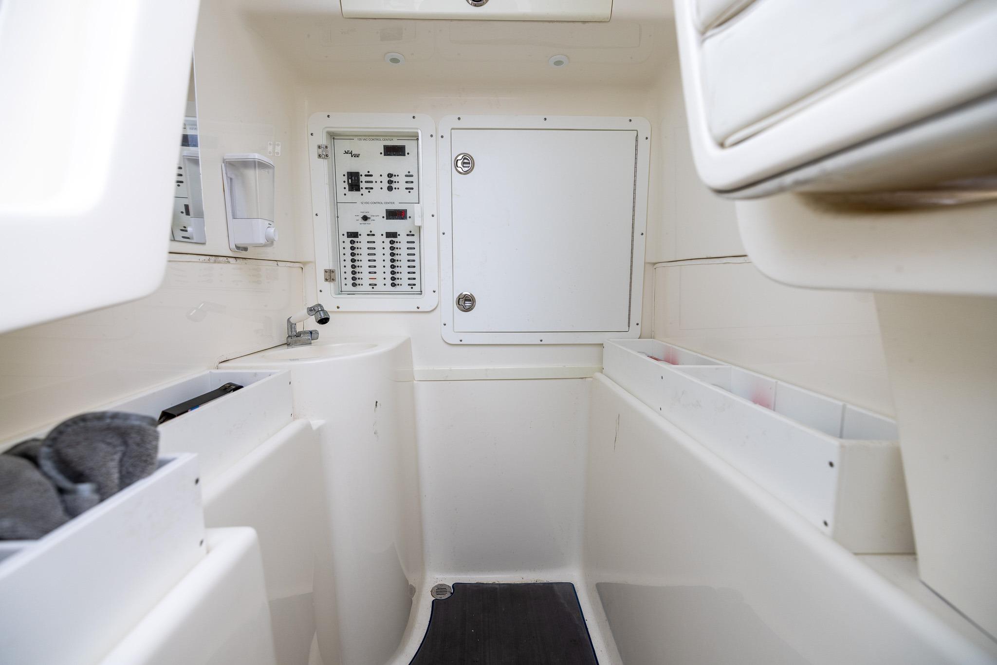 Interior of 2019 SeaVee 322Z boat showing control panel and storage compartments.
