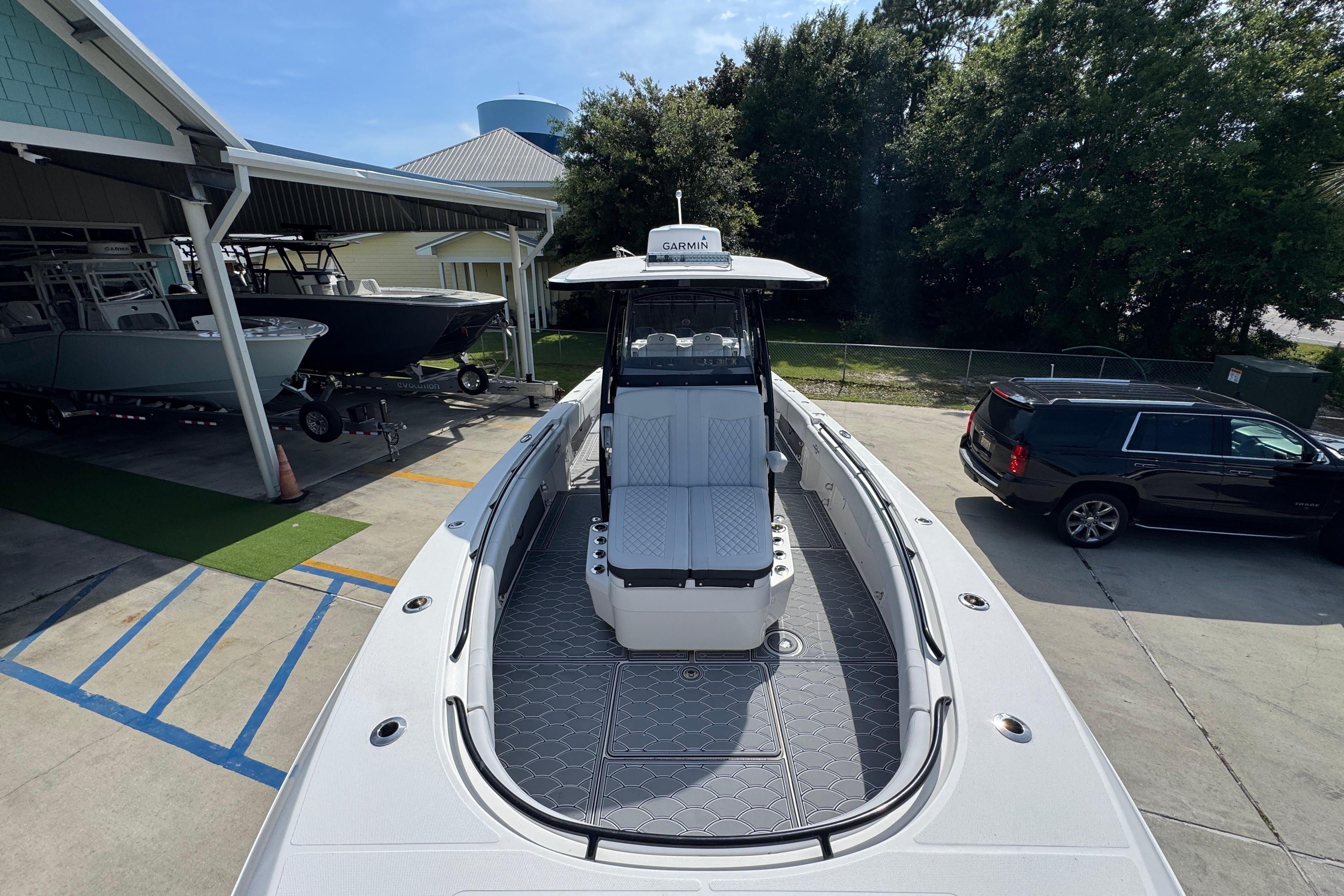 2023 Fountain 34 Tournament Edition boat docked at a marina, showcasing sleek design.