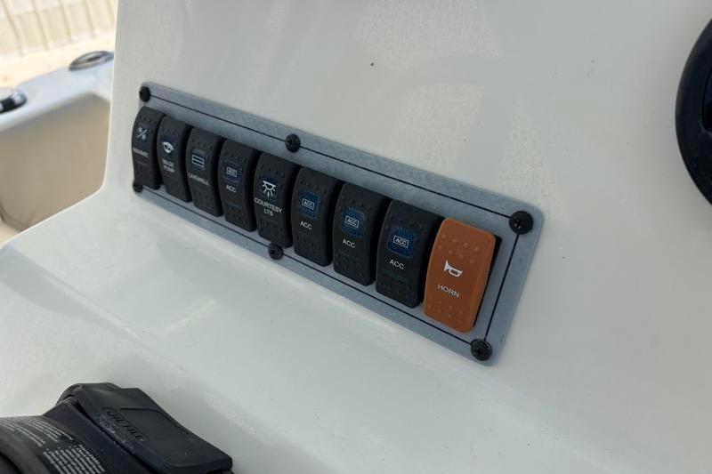 Control panel switches on 2024 Key West 203 FS boat dashboard.