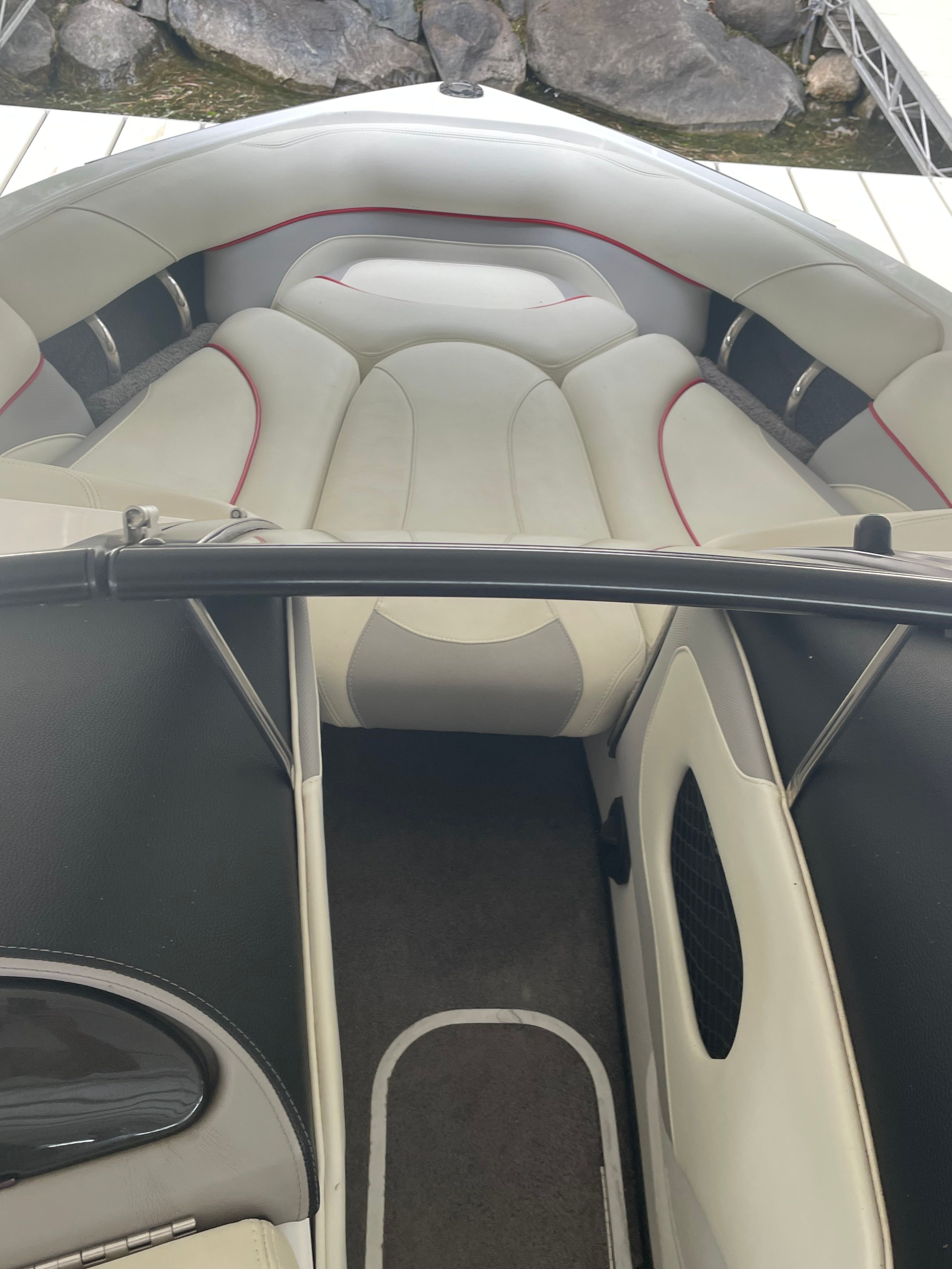 Interior of a 2014 Malibu Response TXi boat with white seating.