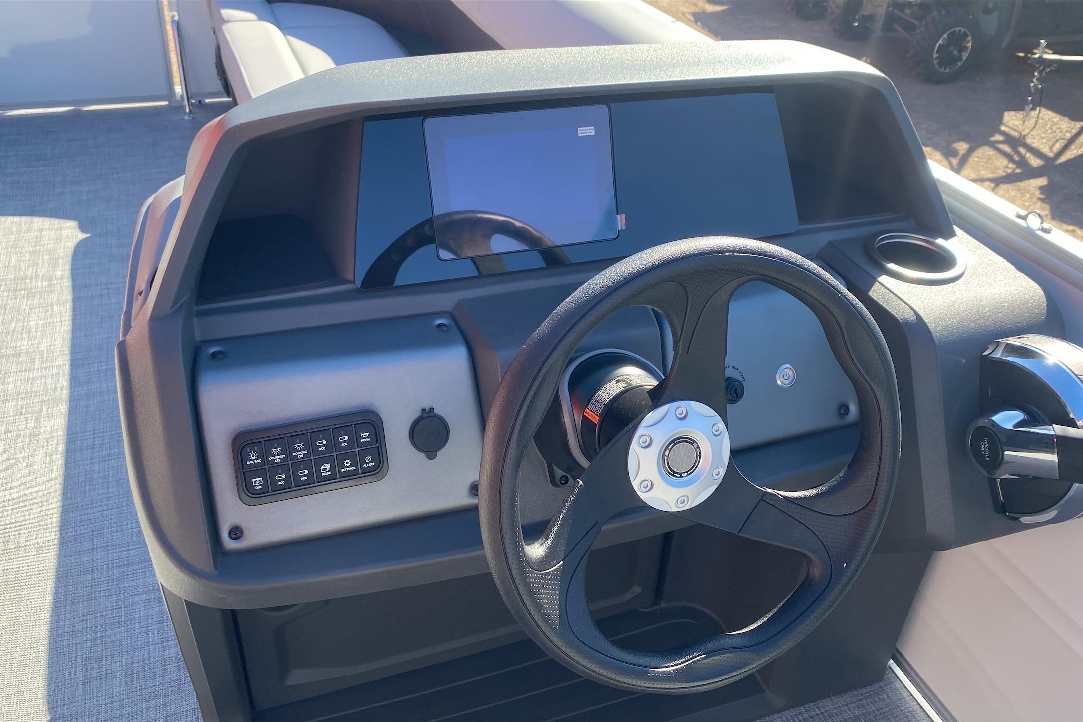 Steering console of 2026 Sun Tracker Party Barge 18 DLX pontoon boat.