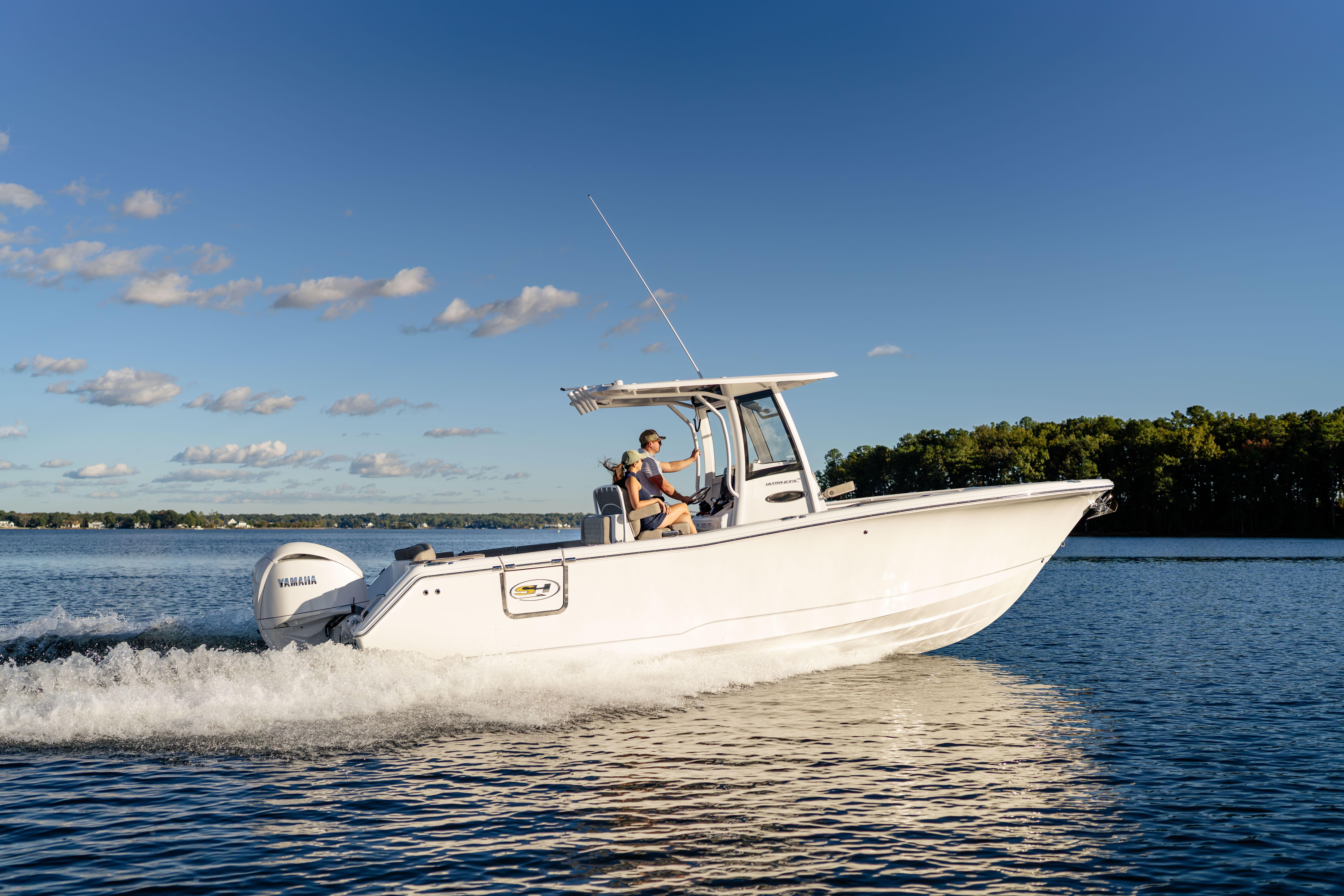 2026 Sea Hunt Ultra 275 Coffin Box cruising on a sunny lake.