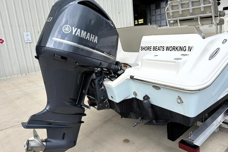 2024 Key West 239 FS boat with Yamaha outboard motor, docked on trailer.