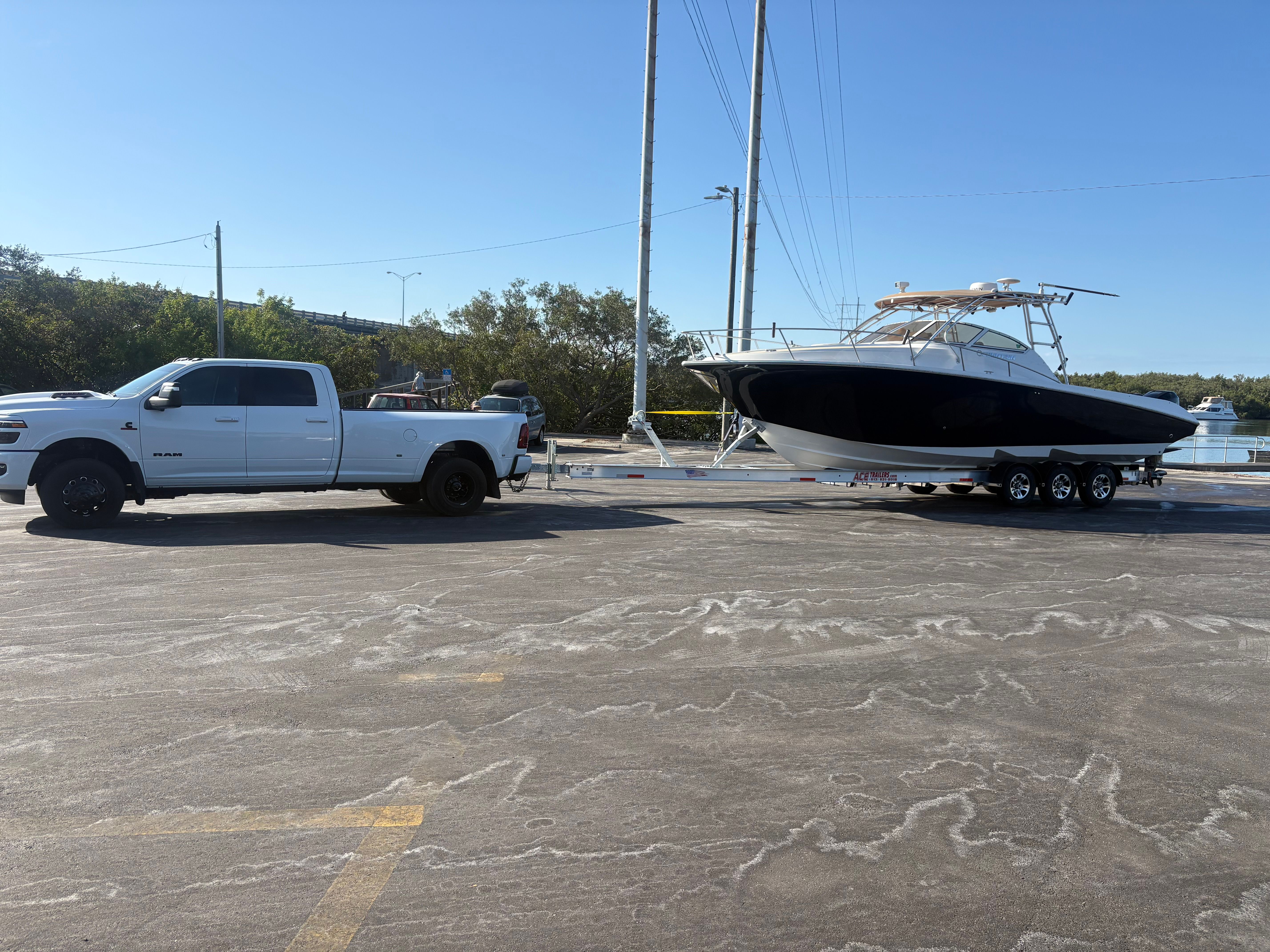 2009 Fountain 33 Sportfish Cruiser on trailer with white truck.