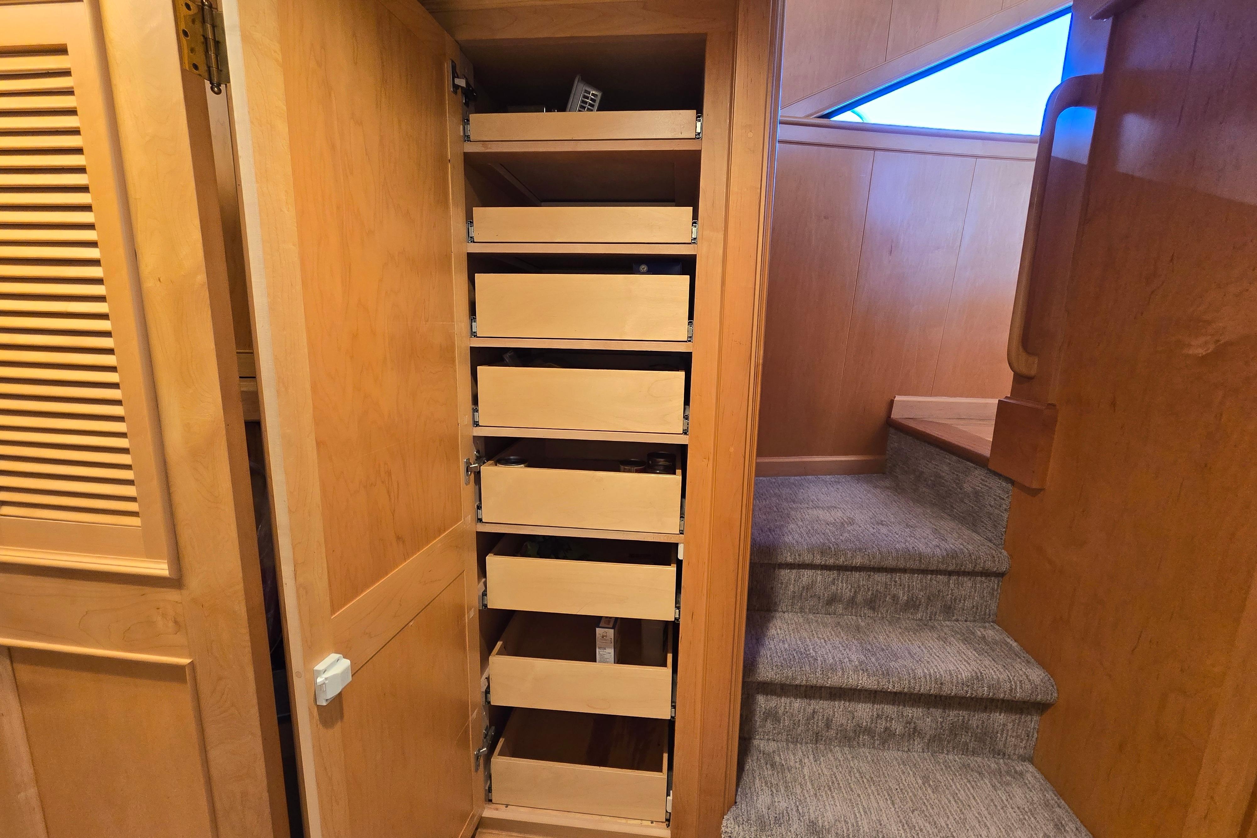 Interior of 1989 Palmer Marine Pilothouse Motor Yacht with open storage drawers.