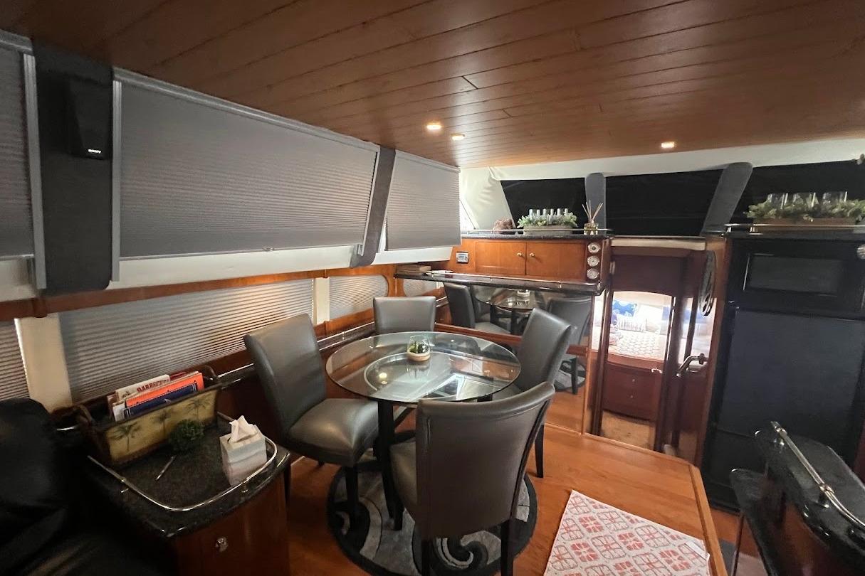 Luxurious interior of a 2000 Carver 506 Motor Yacht with elegant dining area.