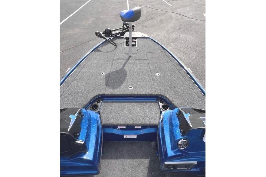 2026 Nitro Z19 XL boat deck with seating and controls in a parking lot.