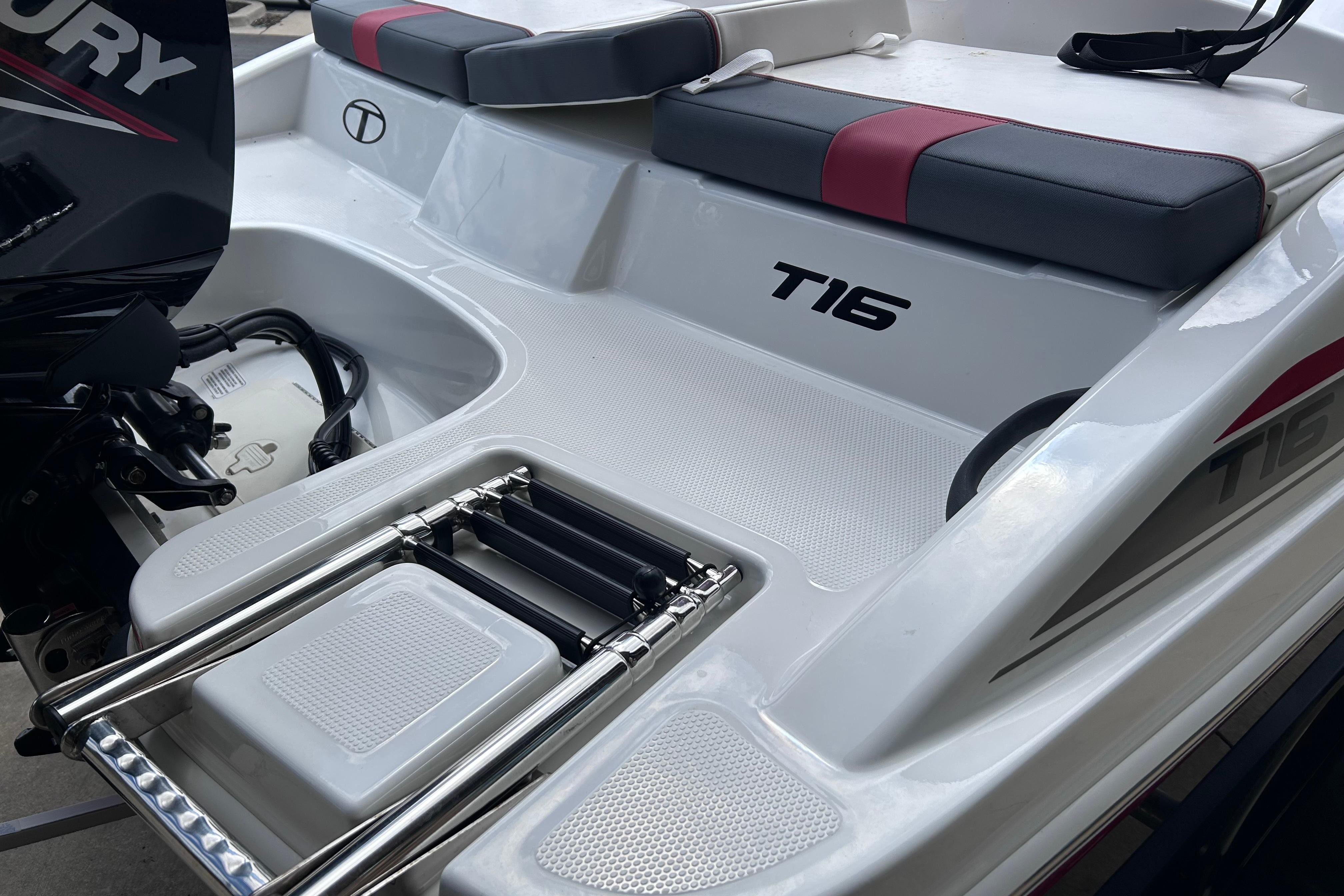 2026 Tahoe T16 boat with seating and ladder, featuring a Mercury engine.