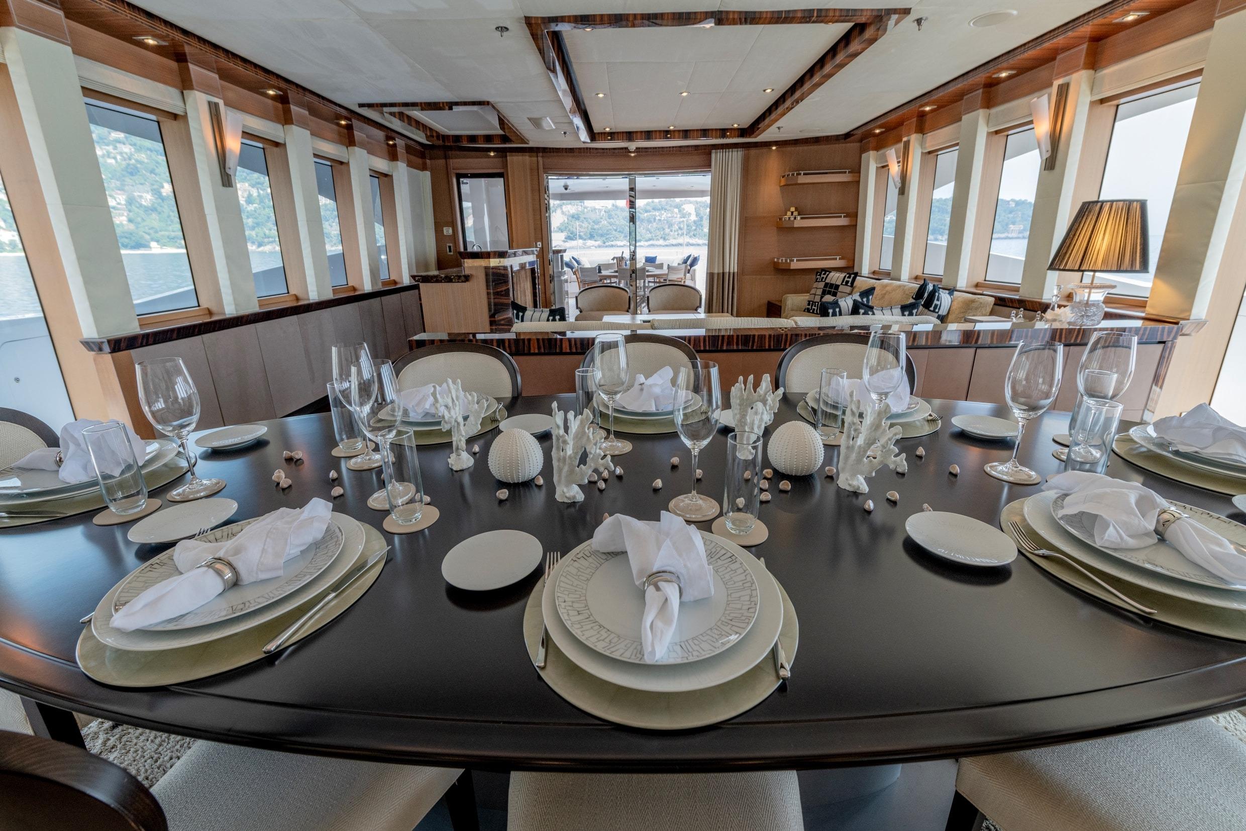 Luxurious dining area on 2008 Palmer Marine PJ150 yacht, elegantly set table with ocean views.