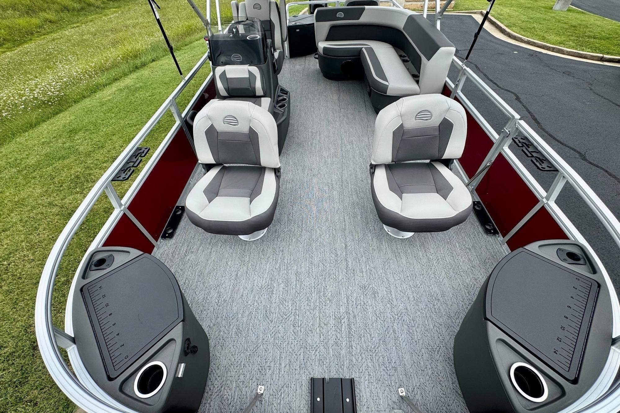 2026 Sun Tracker Bass Buggy 18 DLX pontoon boat interior with seating and fishing stations.
