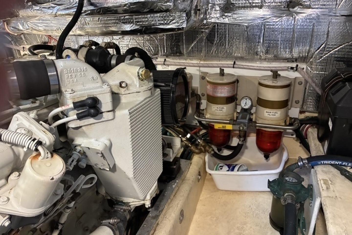 Engine room of a 2000 Nordic Tug 37 with fuel filters and mechanical components.