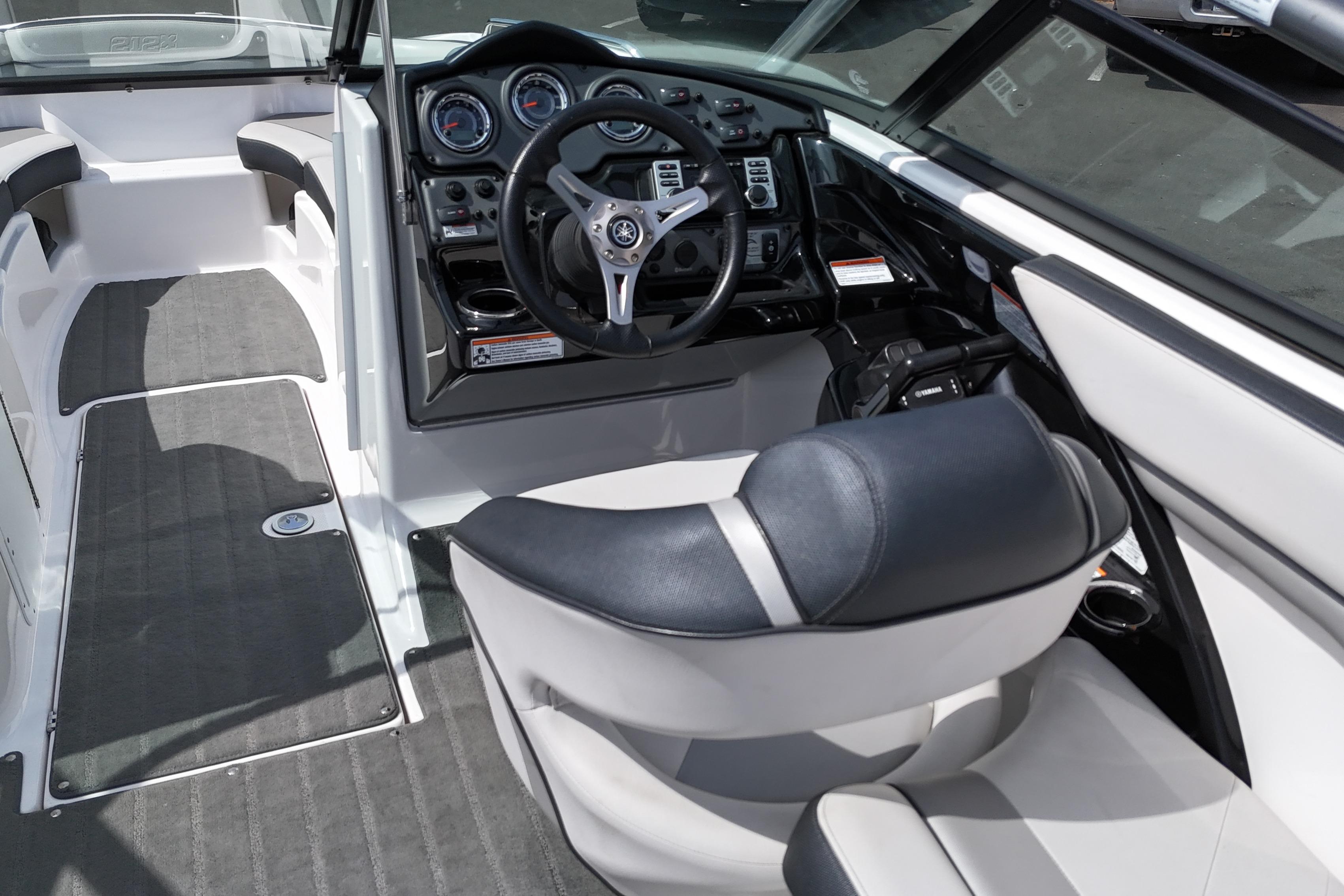 Interior view of a 2016 Yamaha Boats 212X, featuring sleek design and modern controls.
