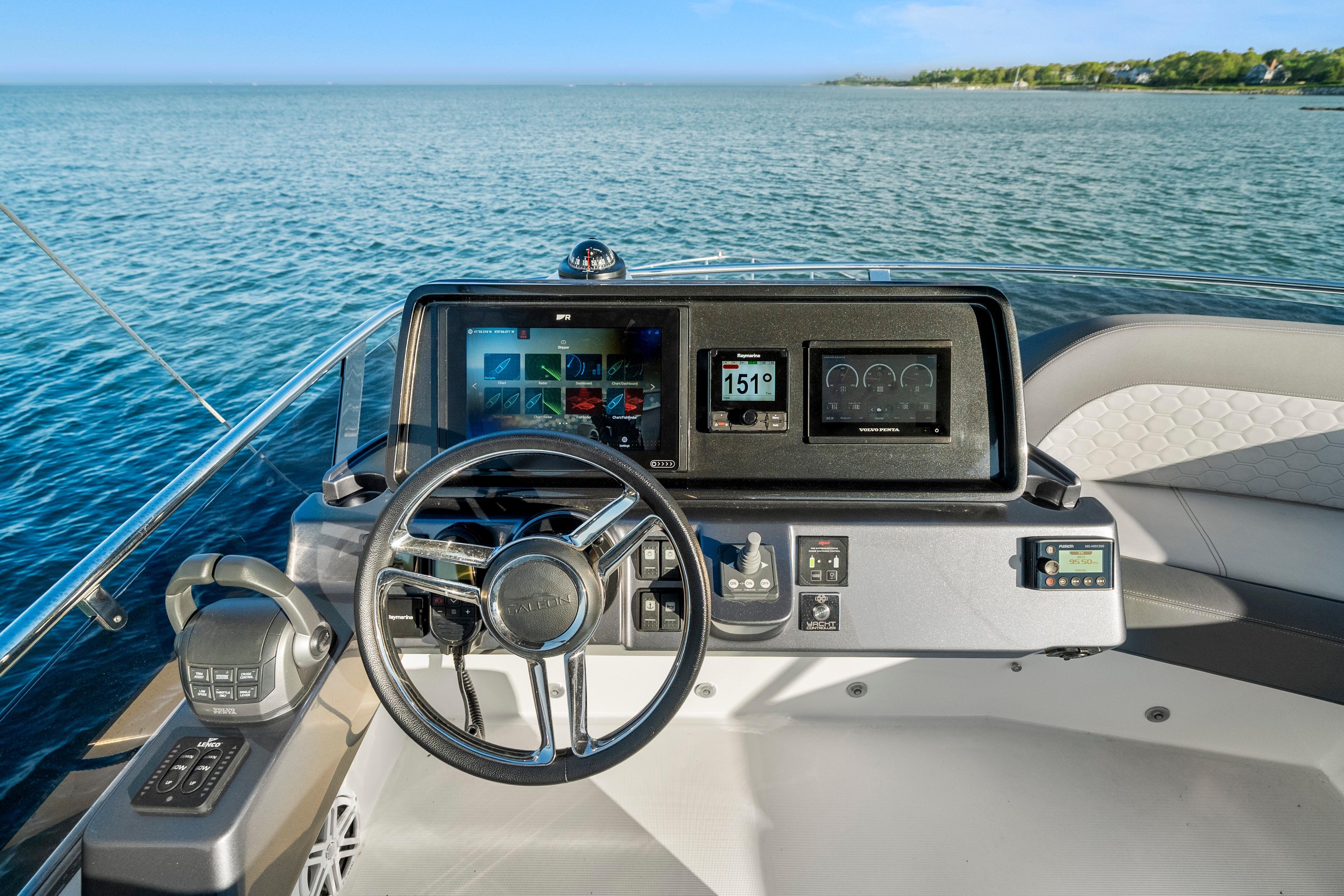 2023 Galeon 400 Fly yacht helm with modern navigation displays on open water.