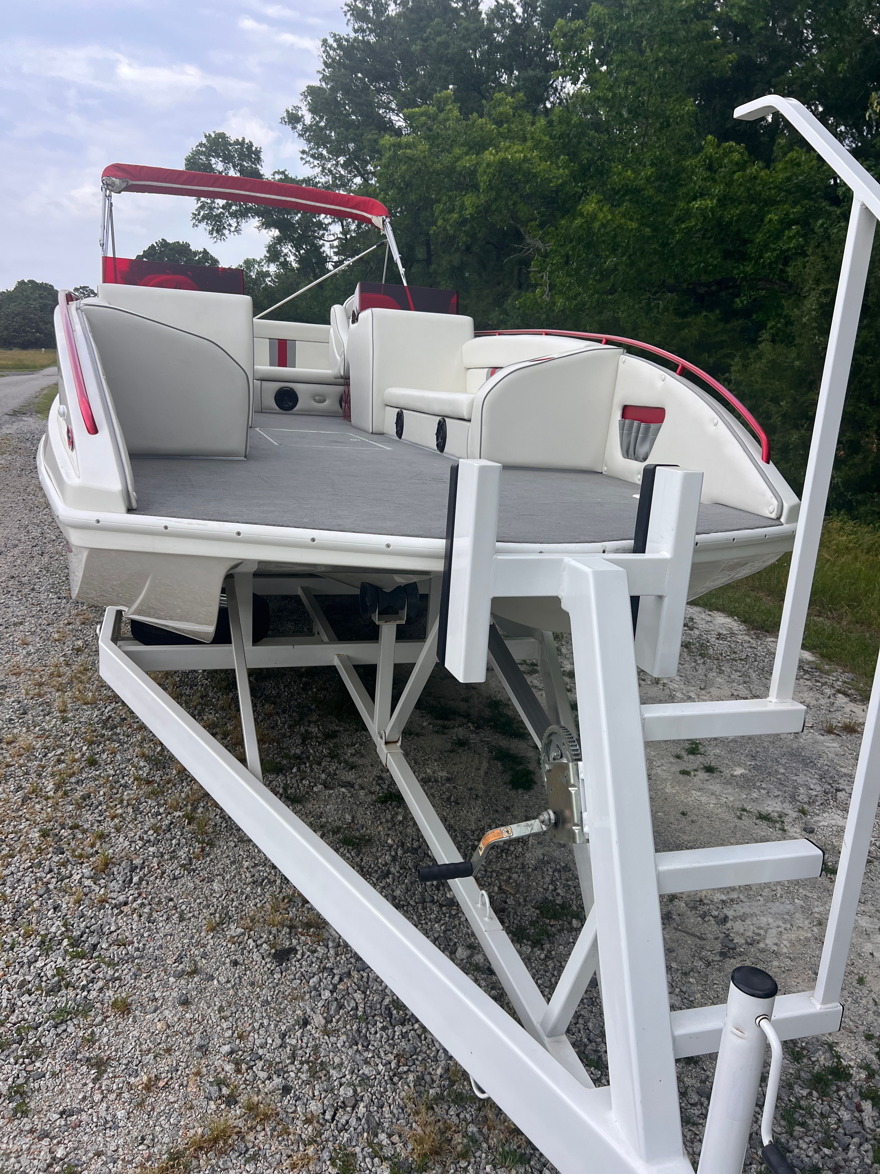 A 2008 Cheetah Fastcat on a trailer, featuring red accents and a ladder.
