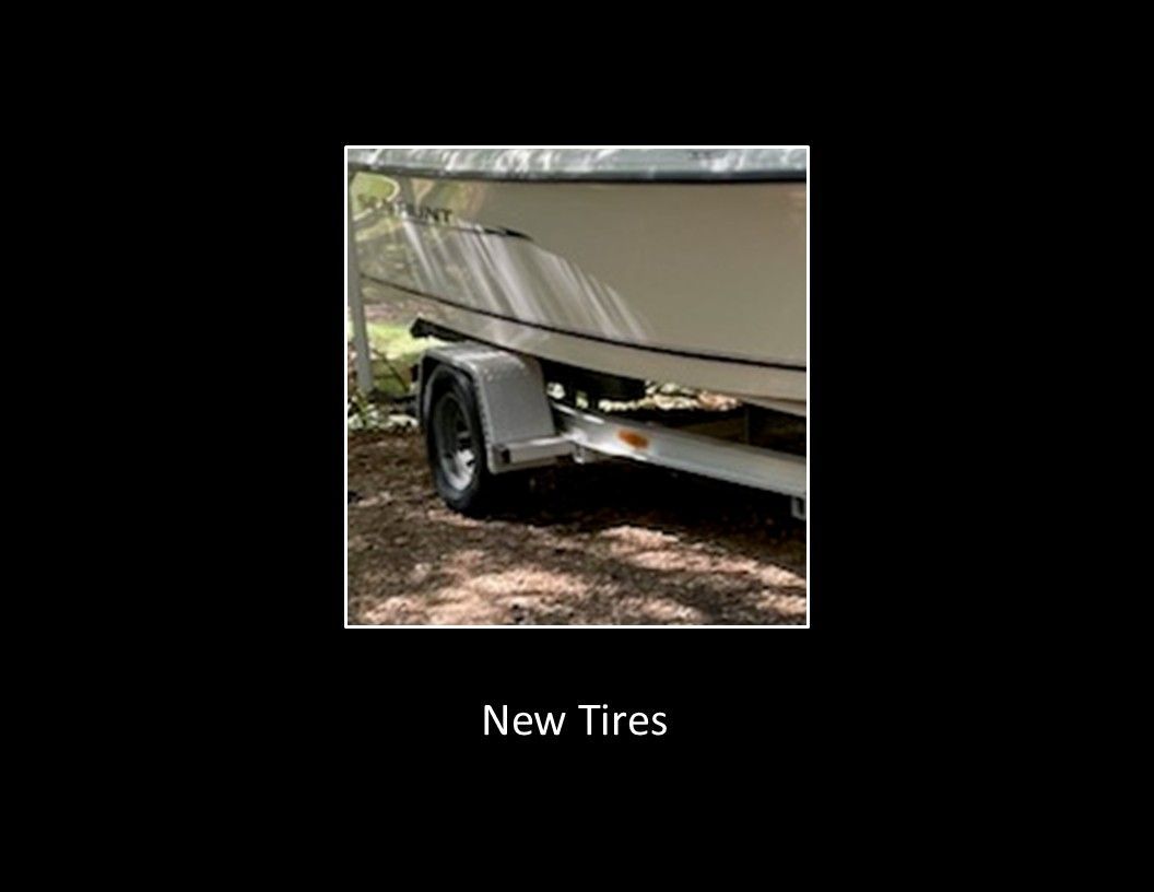 Sea Hunt Escape 2004 on a trailer with new tires.
