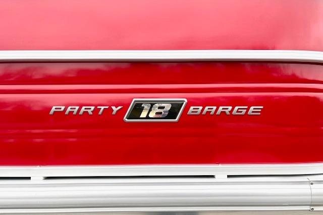 2026 Sun Tracker Party Barge 18 DLX, red exterior with model emblem.