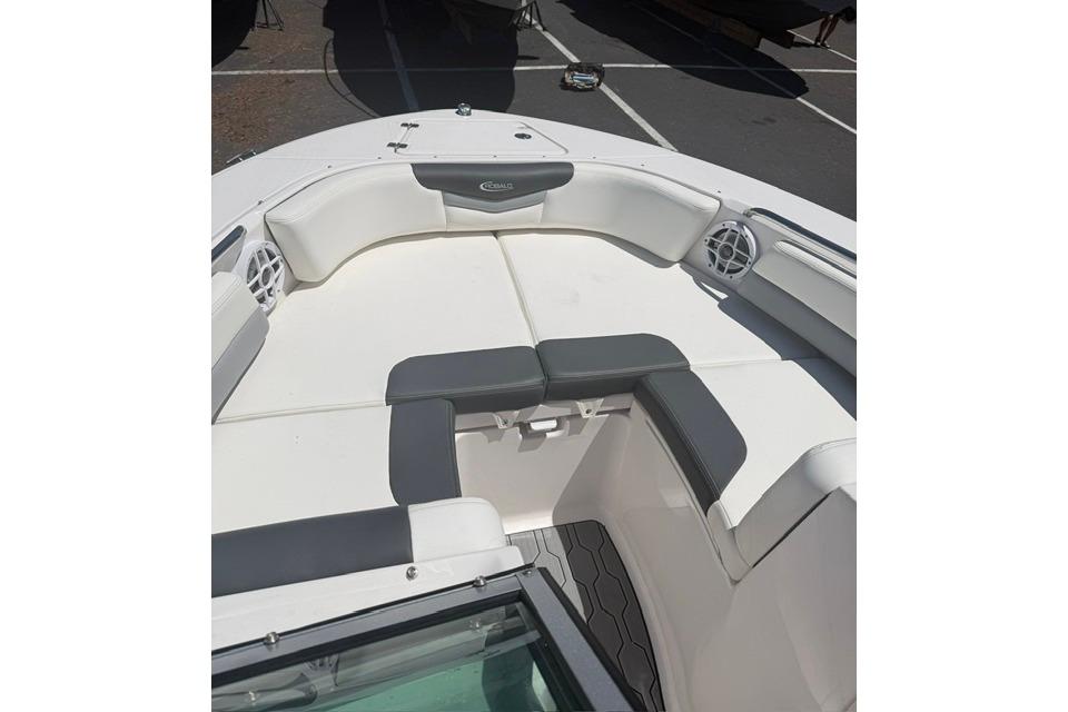 2024 Robalo R207 Dual Console boat interior with cushioned seating and speaker system.
