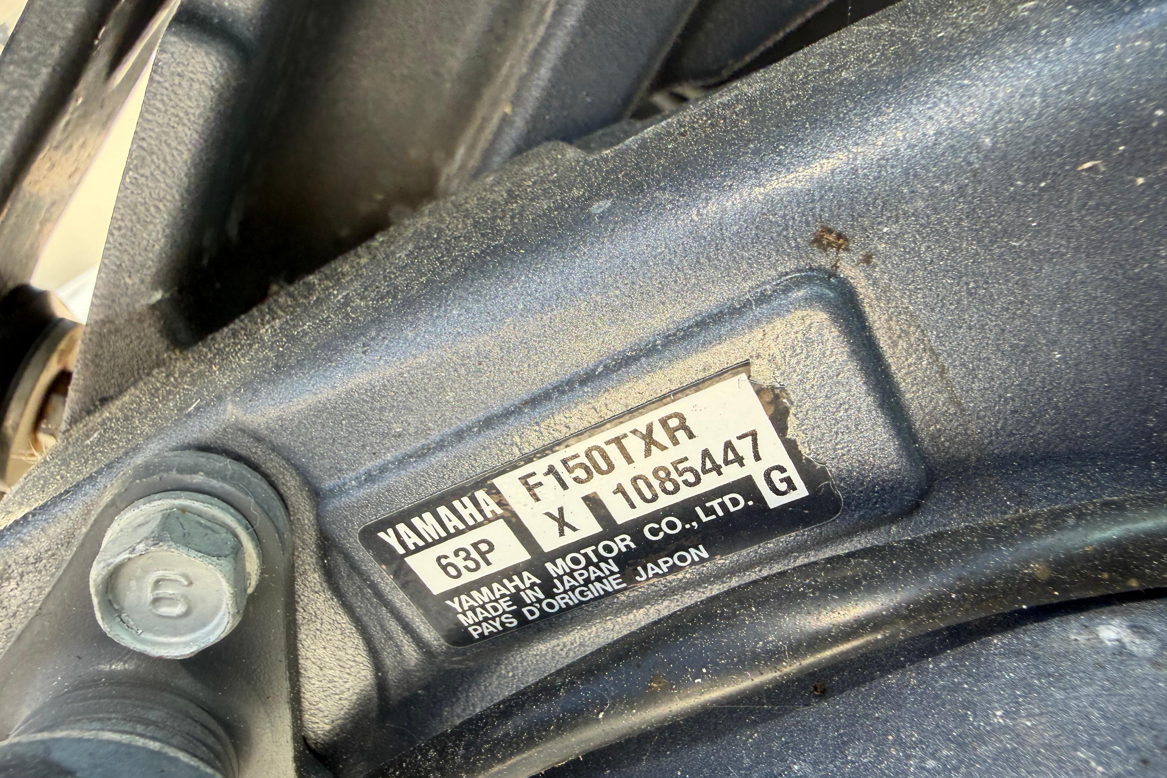Close-up of Yamaha F150TXR engine label on 2010 Pursuit OS 255 Offshore boat.