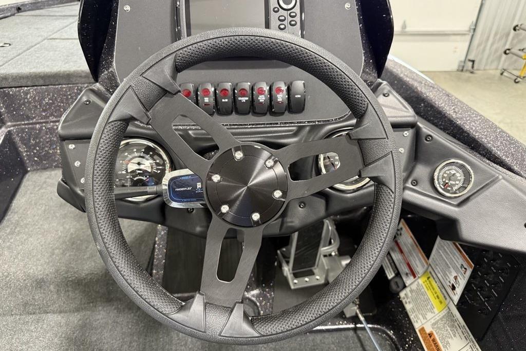 Steering wheel and dashboard of 2025 Skeeter ZX150 boat, featuring modern controls.