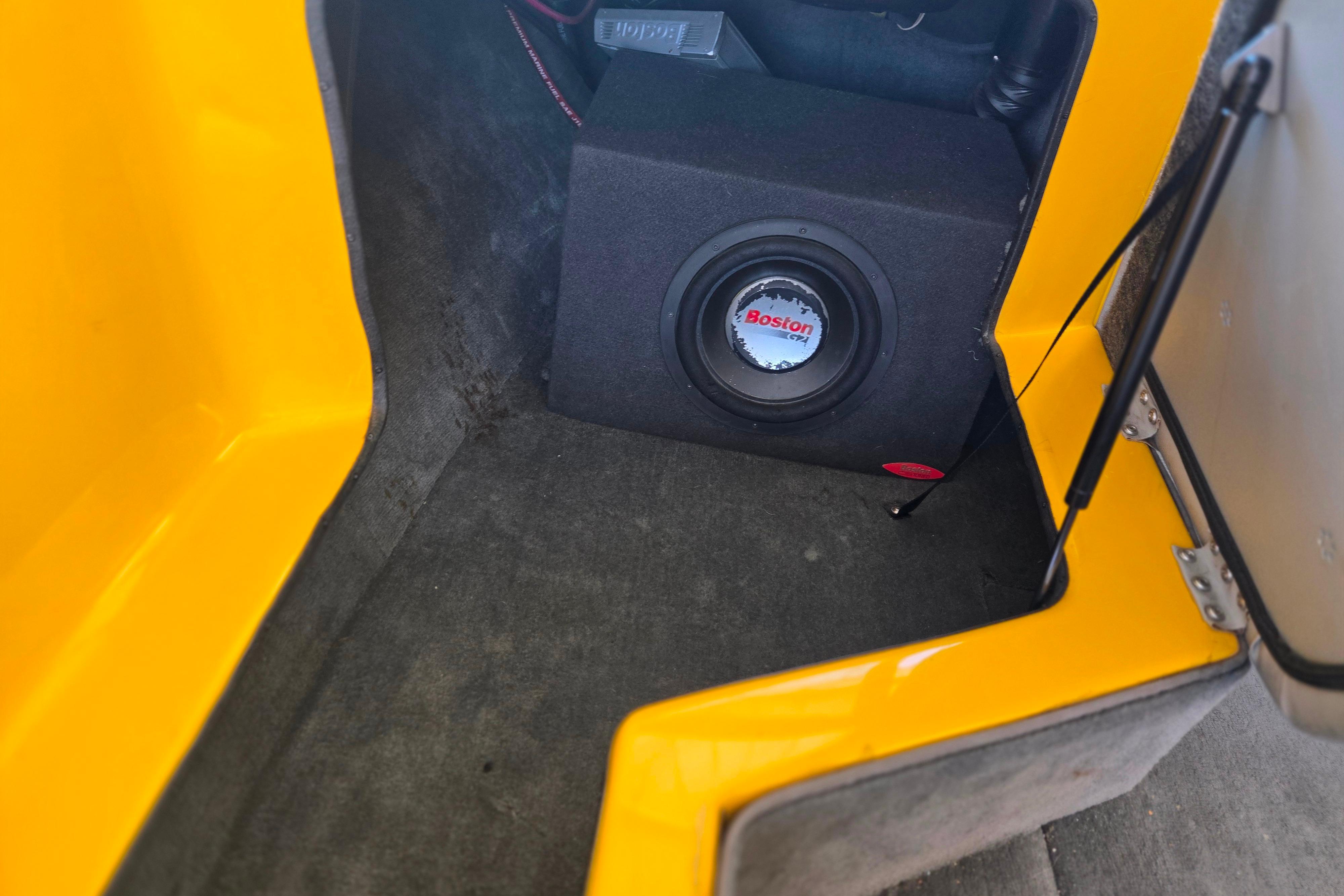 2007 Calabria CAL AIR PRO V interior with Boston subwoofer in yellow compartment.