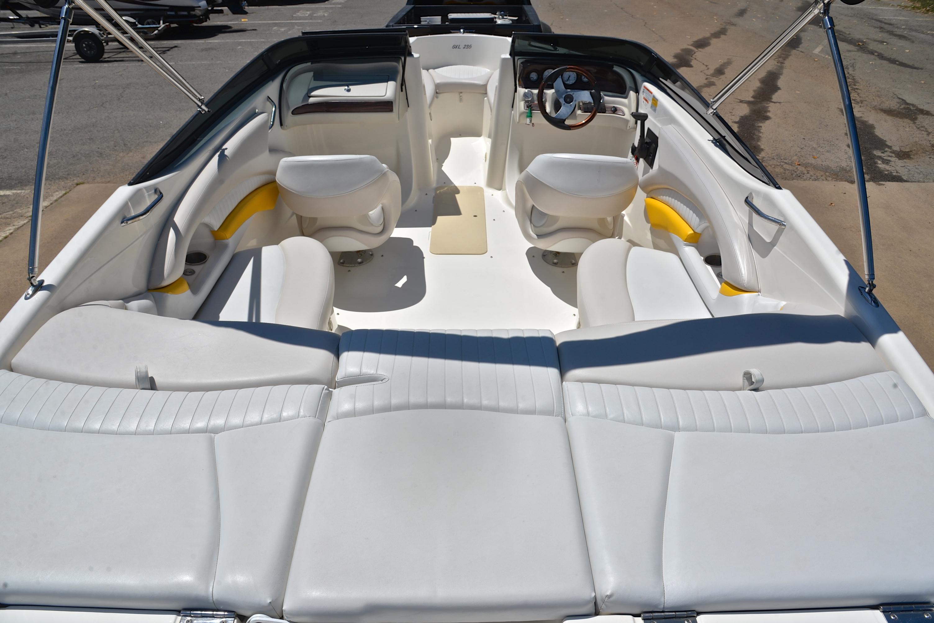 2007 Glastron GXL 235 boat interior with white seating and steering wheel.