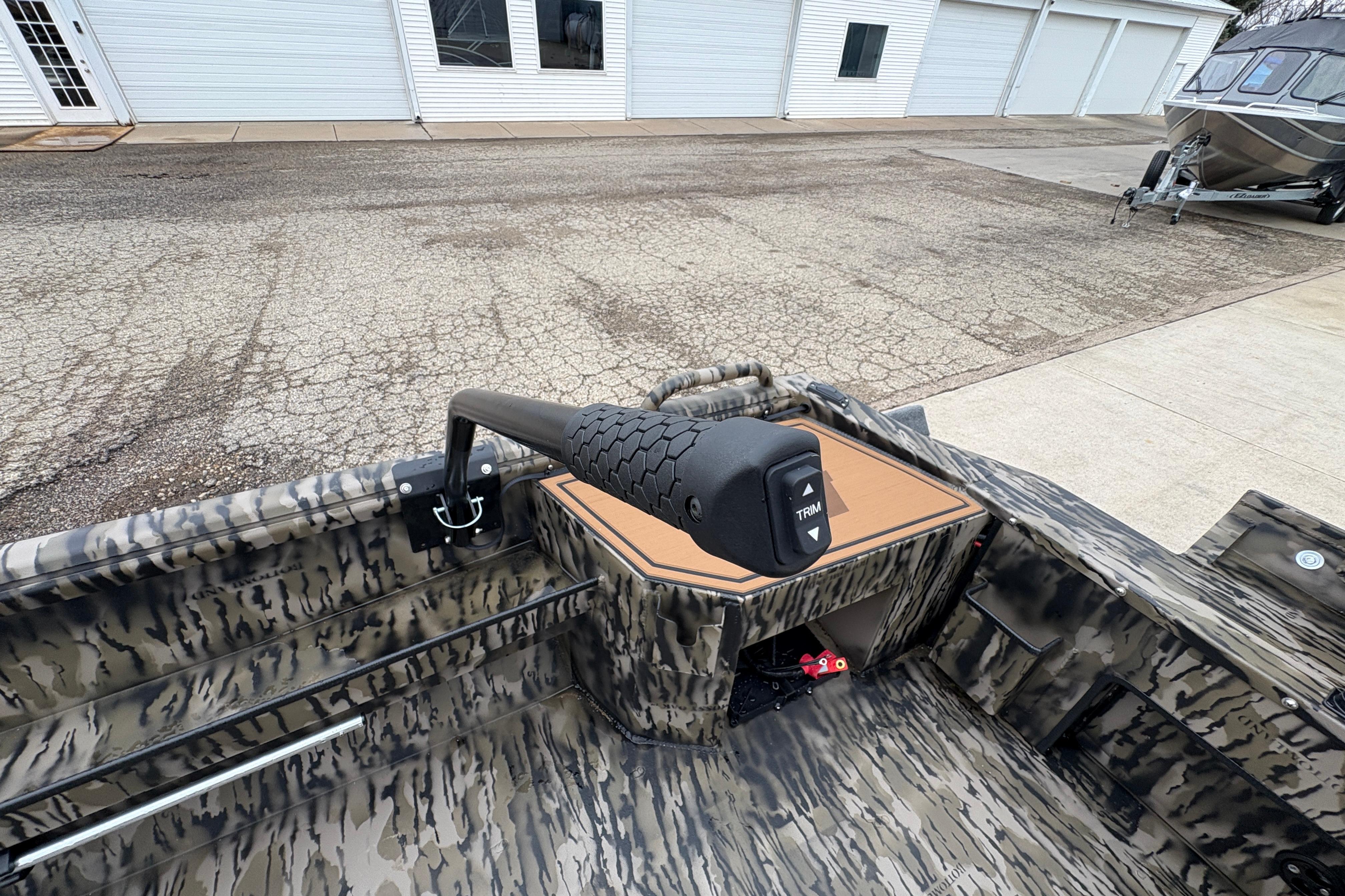 2026 Excel 1860 F4 Pro boat interior with camo design and trim control.
