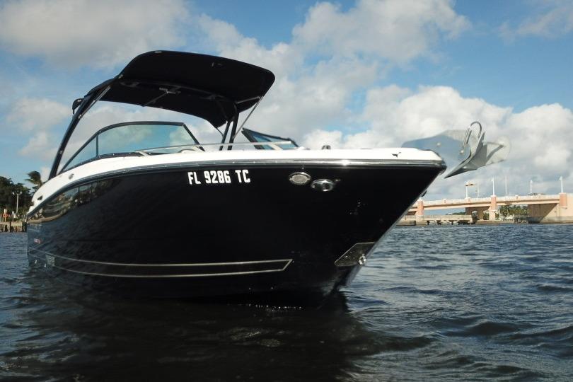 2022 Monterey 255SS Super Sport boat on water, under a cloudy sky.