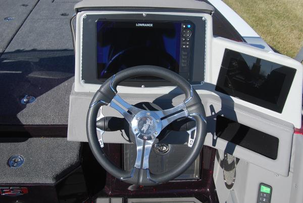 2024 Ranger 620FS Pro boat dashboard with Lowrance electronics and steering wheel.