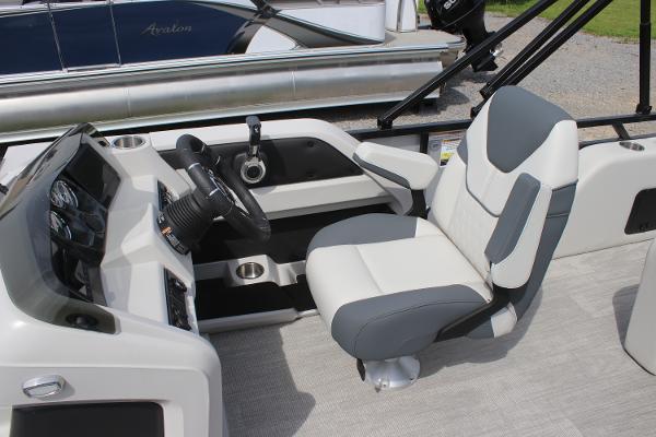 2025 Avalon LSZ Versatile Rear Lounger boat interior with modern steering console and comfortable seating.