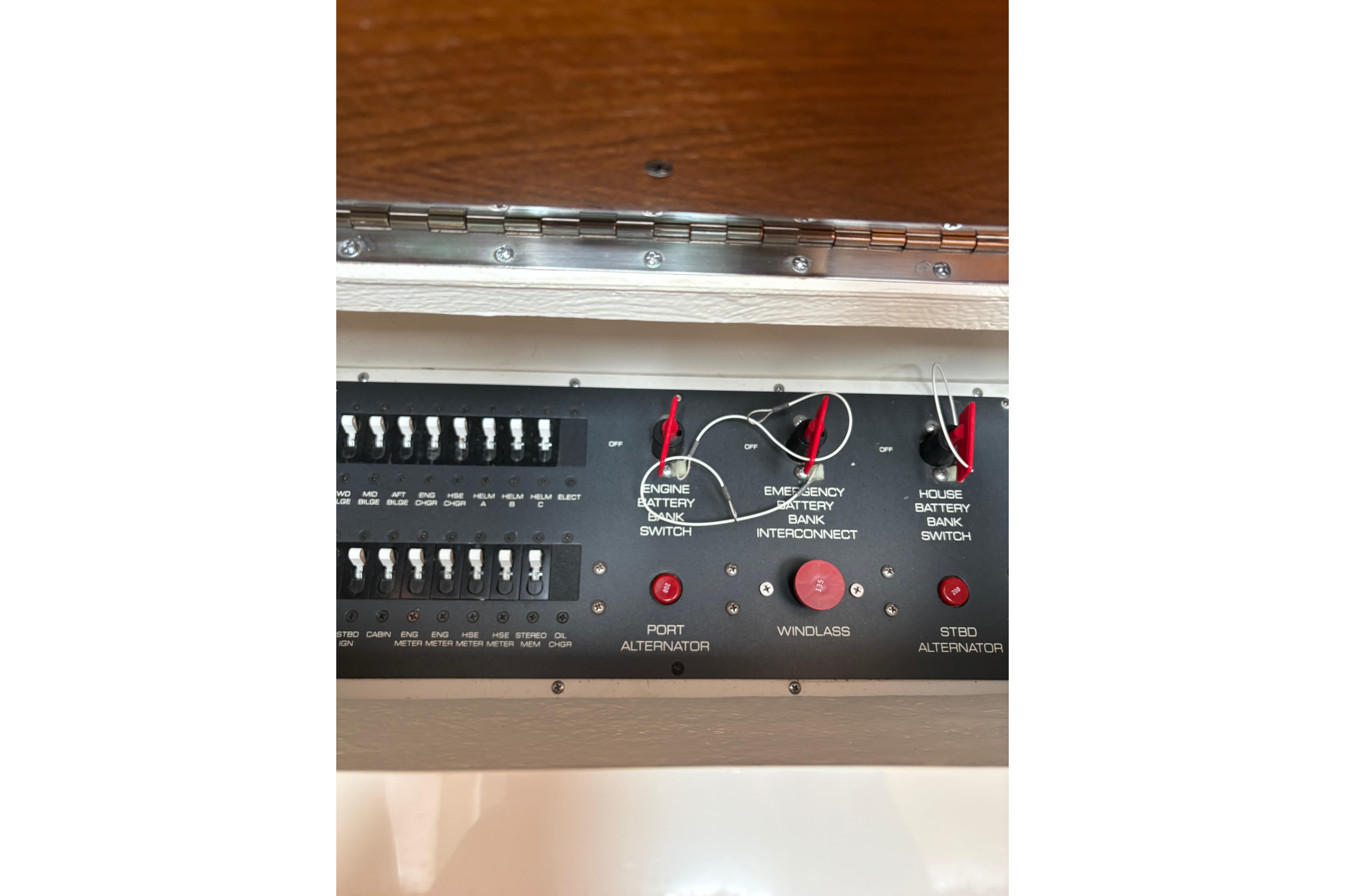 Control panel of a 1999 Tiara Yachts 3100 Open, featuring battery switches and alternator controls.