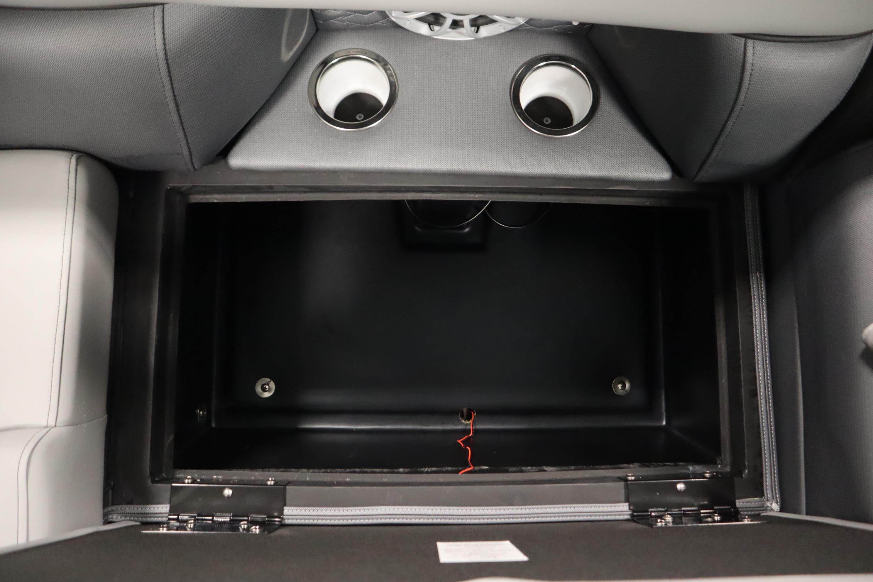 2025 Bentley Pontoons Elite 253 Admiral Tri-toon storage compartment with cup holders.