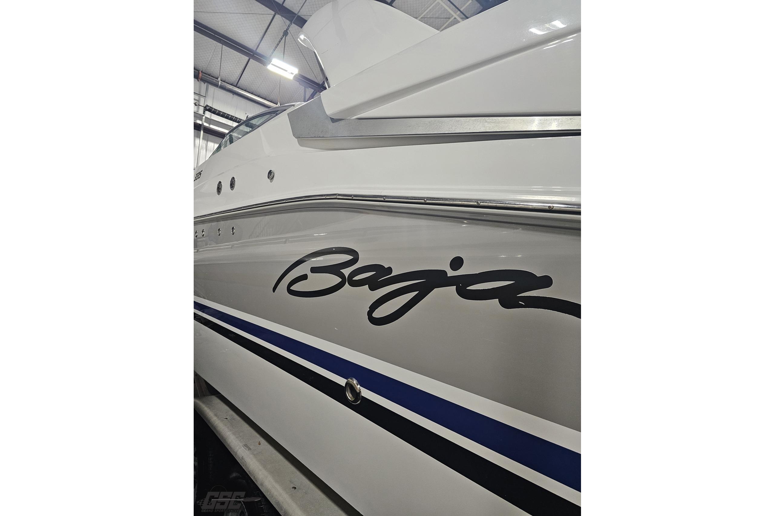 2008 Baja 335 Performance boat with sleek design and bold logo in a showroom.