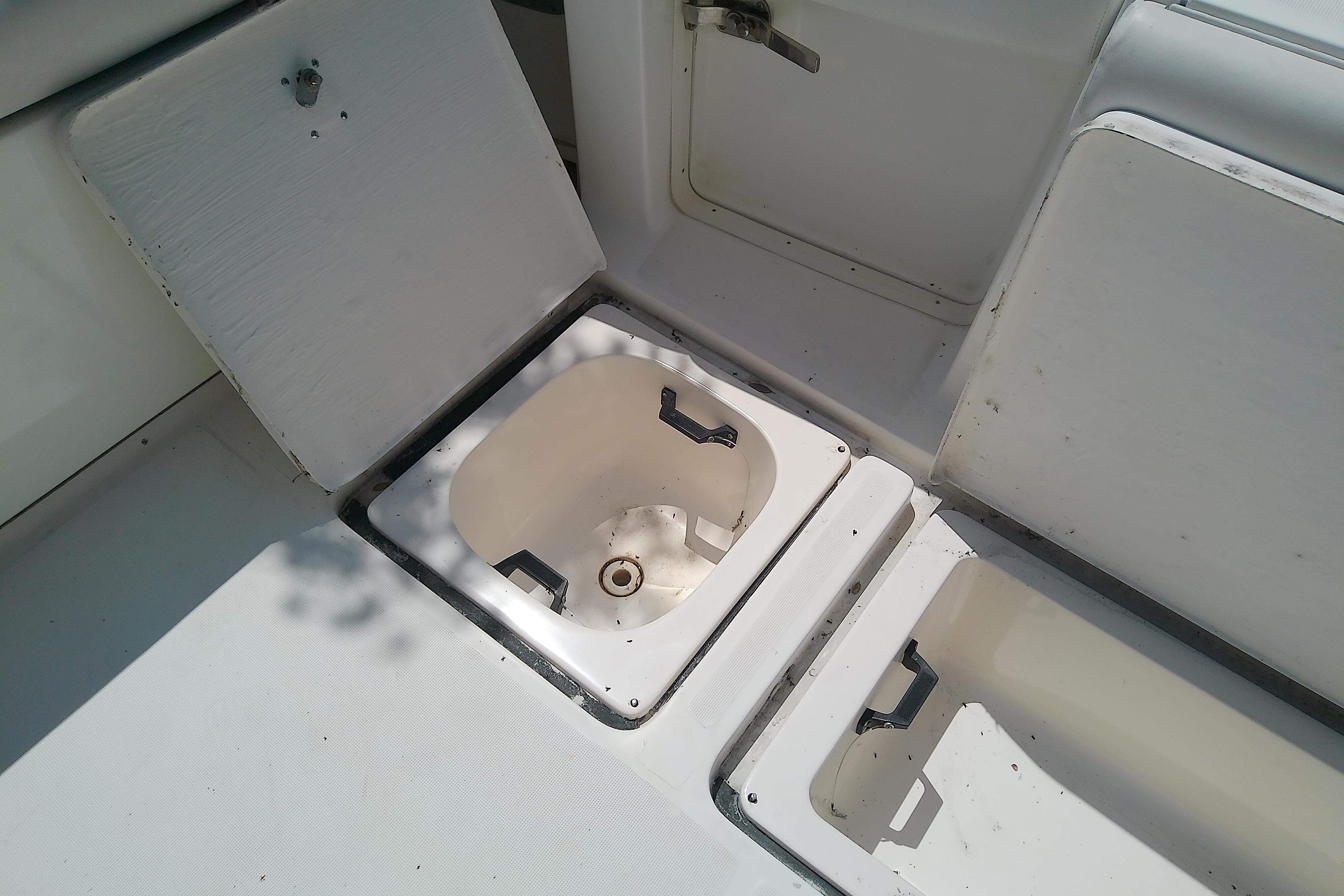 Open storage compartments on a 2000 Tiara Yachts 4100 Open boat deck.
