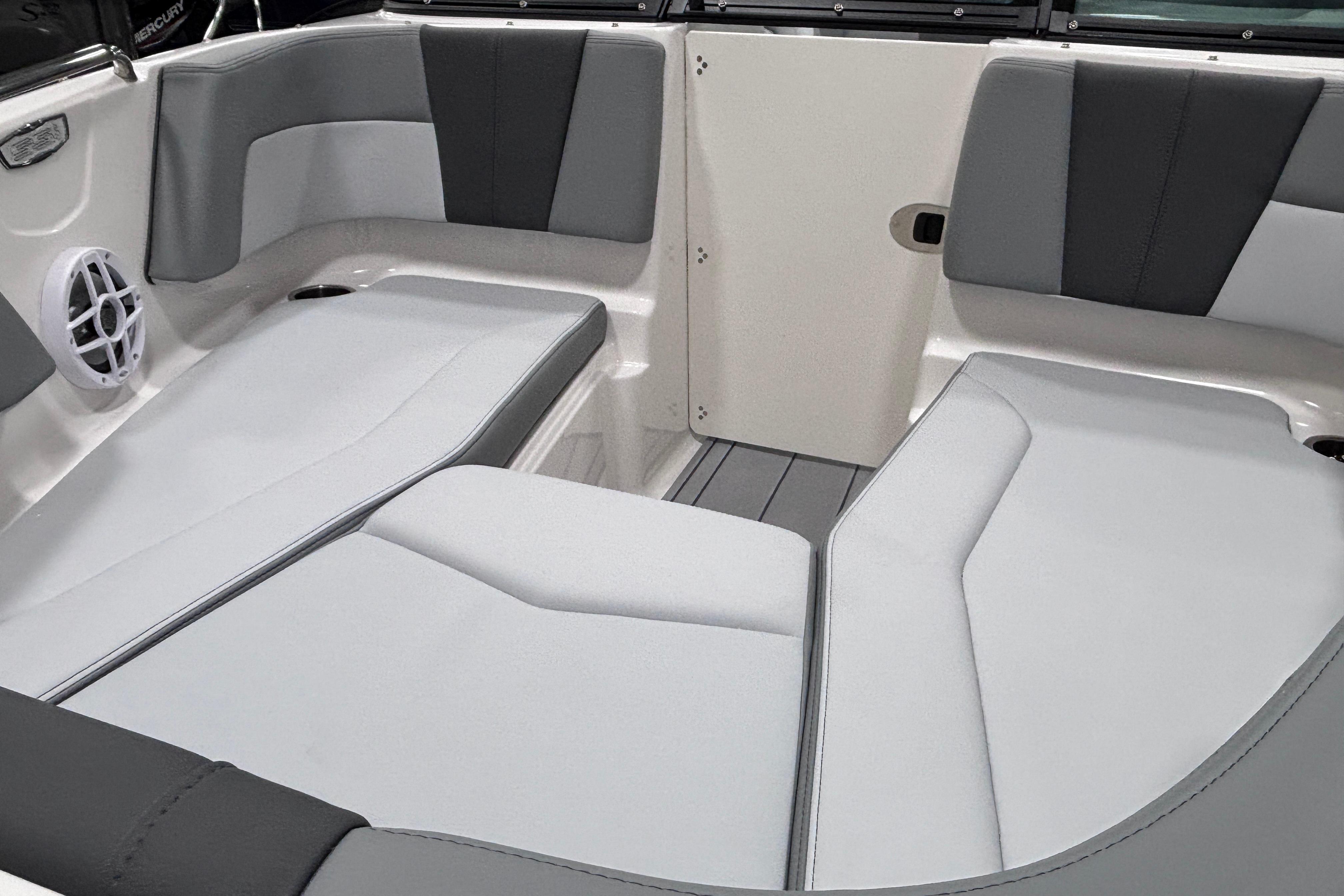 Interior seating of 2026 Chaparral 21 SSi boat, featuring gray and white upholstery.