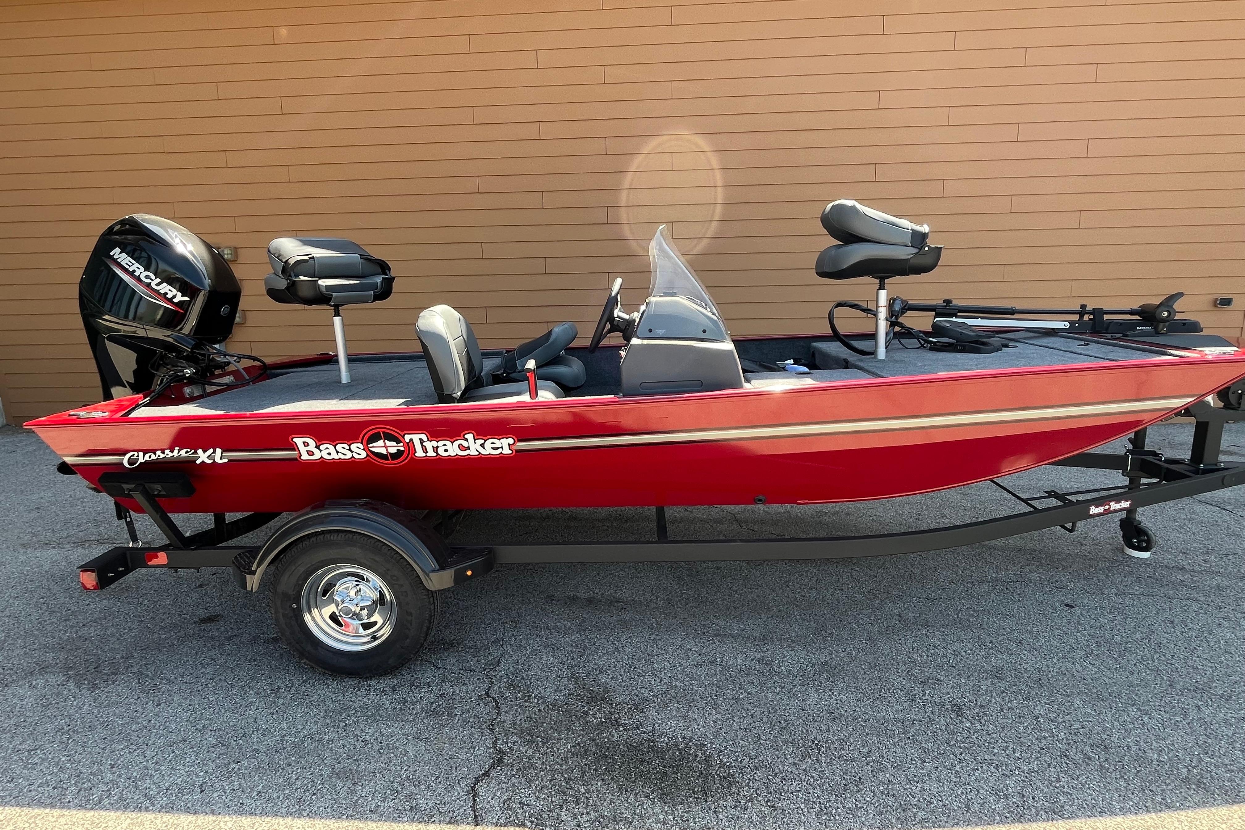 2026 Tracker Bass Tracker Classic XL boat, red, on trailer, with Mercury outboard motor.
