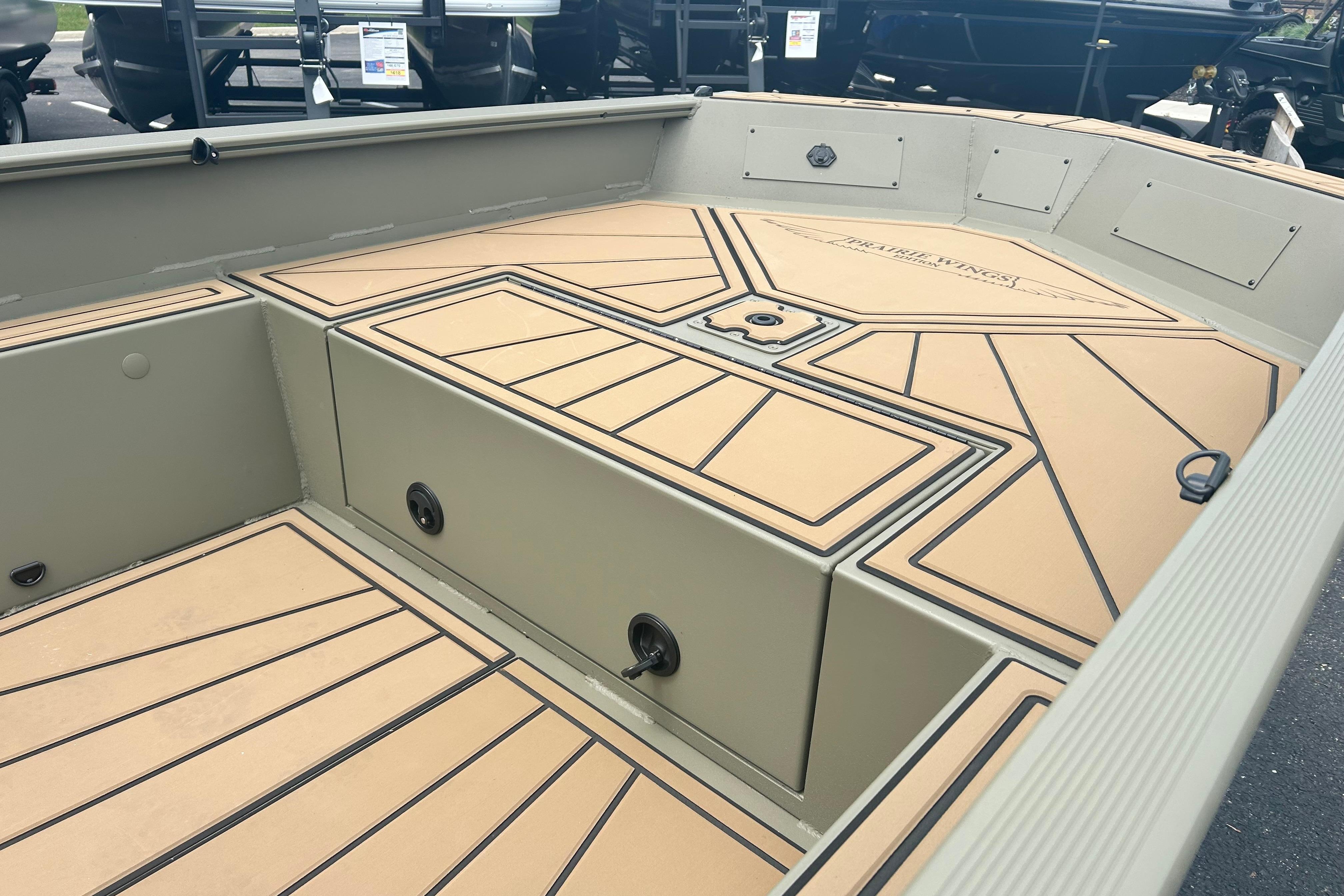 2026 Tracker Grizzly 1650 T Prairie Wings Edition boat interior with tan and black deck design.