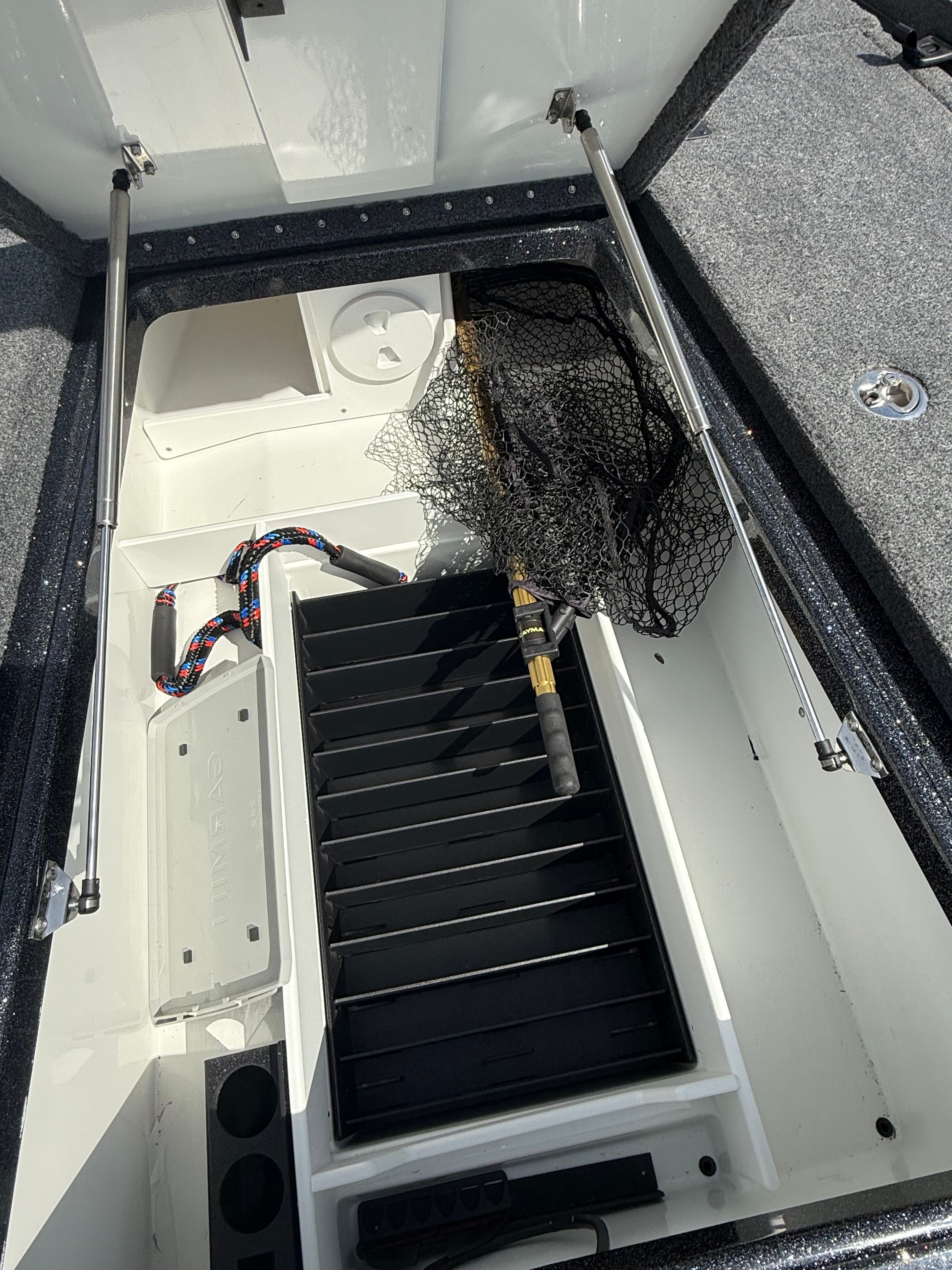 Interior view of 2025 Phoenix 721 ZXL with fishing gear.