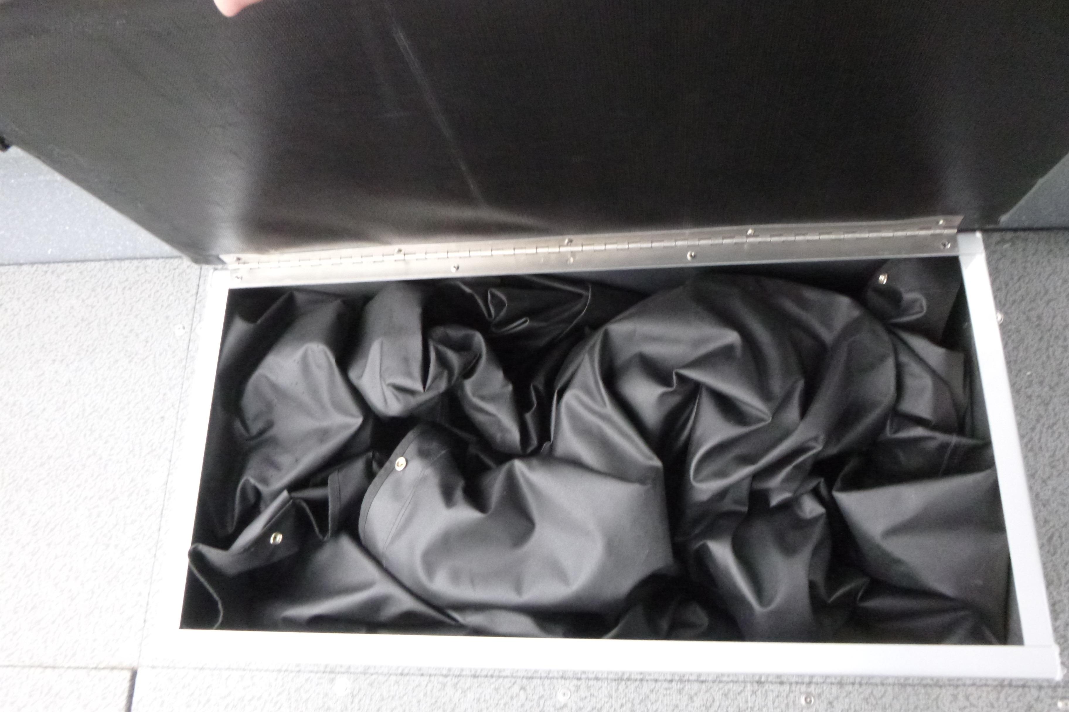 Storage compartment with black fabric inside, KingFisher 2025 Escape, 2026 model.
