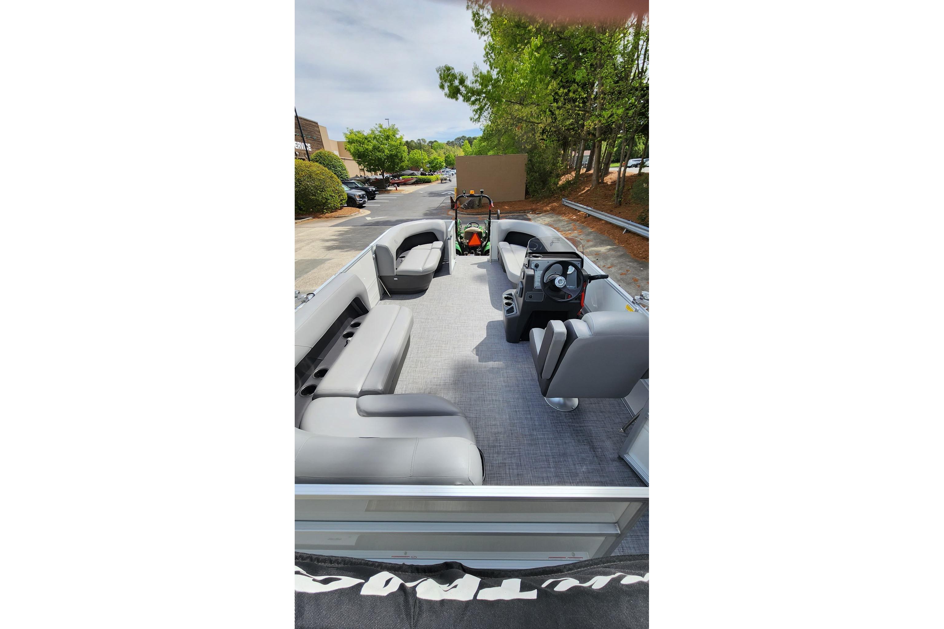 2026 Sun Tracker Party Barge 16 DLX pontoon boat with spacious seating and modern design.
