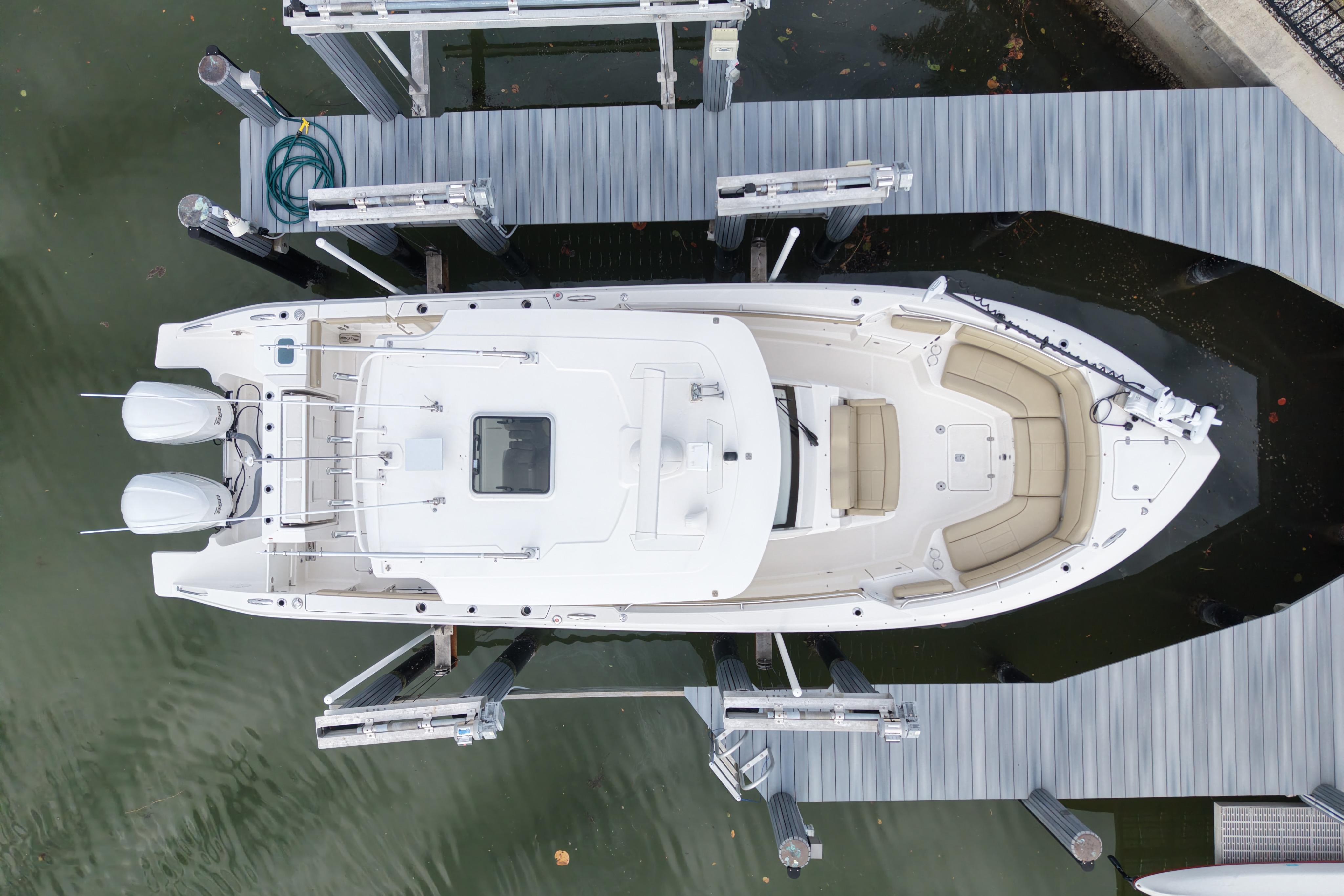 Overhead view of 2020 Pursuit S 328 Sport boat docked at marina.
