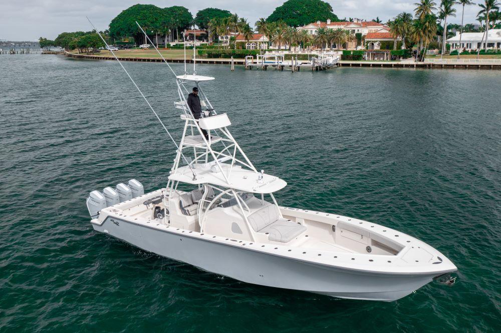 2023 SeaVee 420Z boat on water, featuring multiple outboard engines and a sleek design.