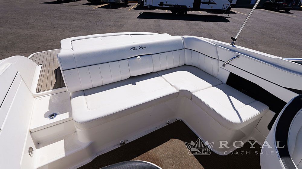 The image shows the white seating area of a 2014 Sea Ray SLX 230 boat.