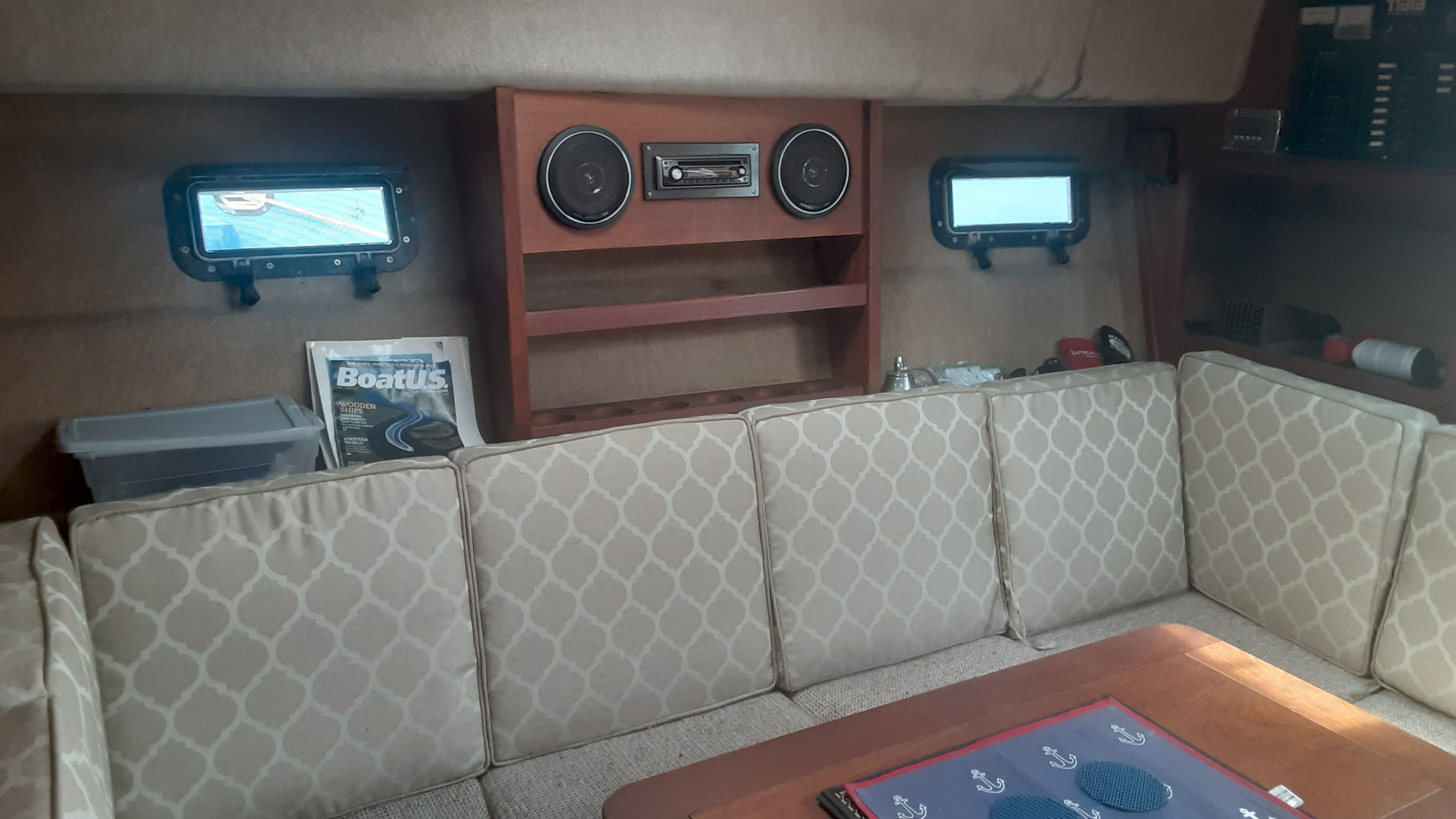 Interior of a 1985 Tiara Yachts 3100 Open with cushioned seating.