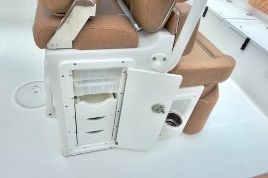 2026 Sea Hunt Ultra 255 SE boat seating with storage compartments open.