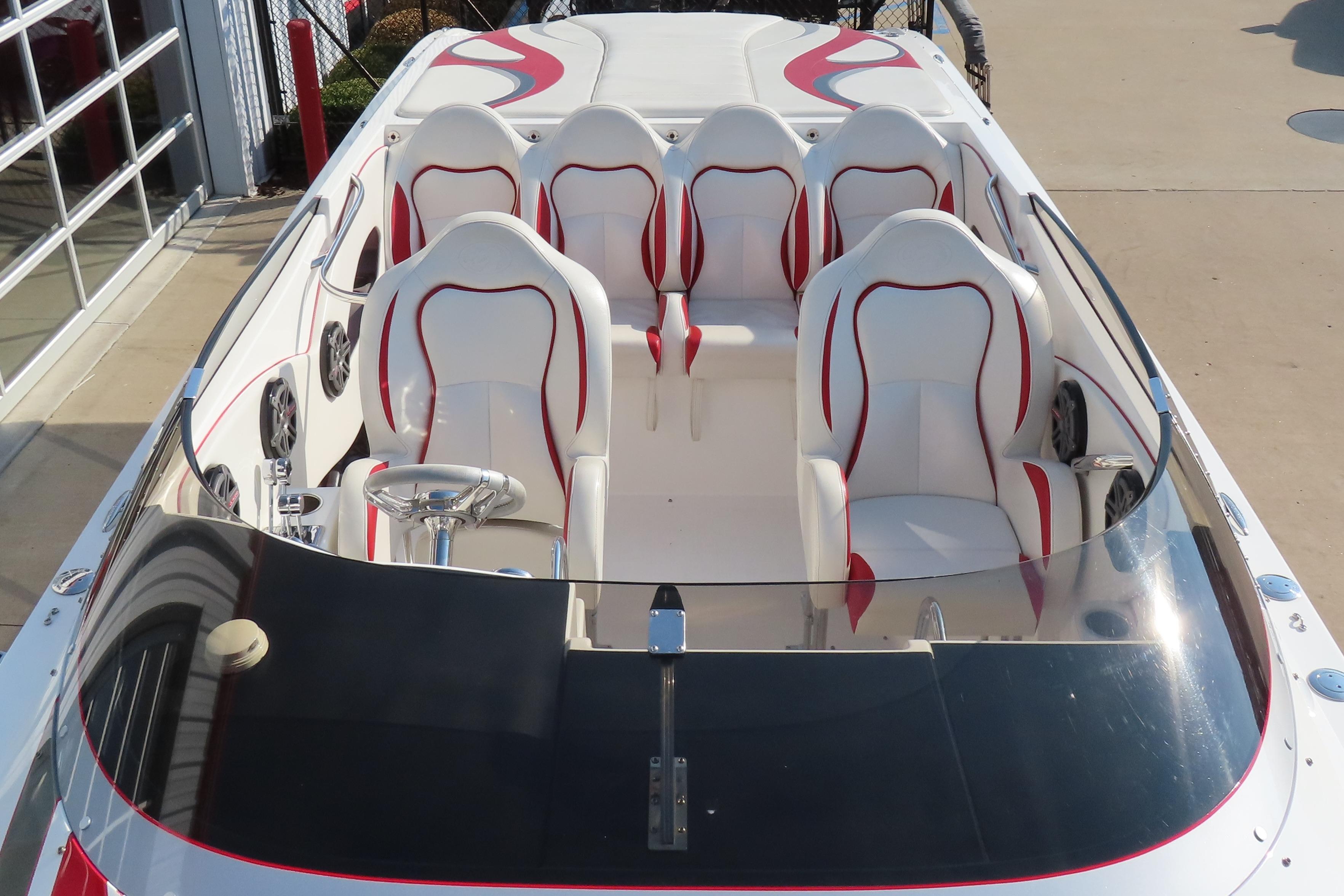 2013 Nordic 39 POKER RUN boat interior with white and red seating, sleek design.