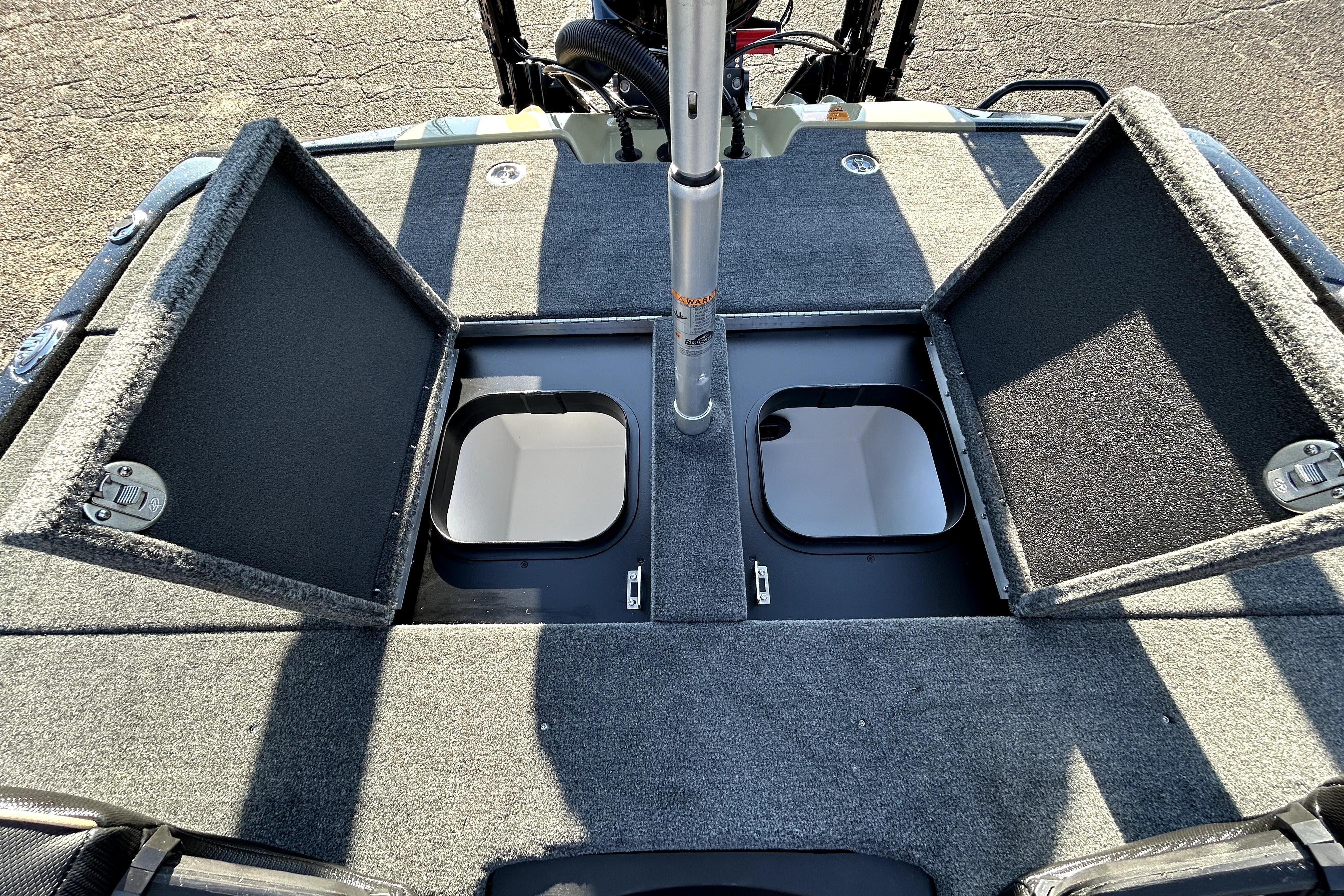 Skeeter ZXE21 2026 boat with open storage compartments on deck.