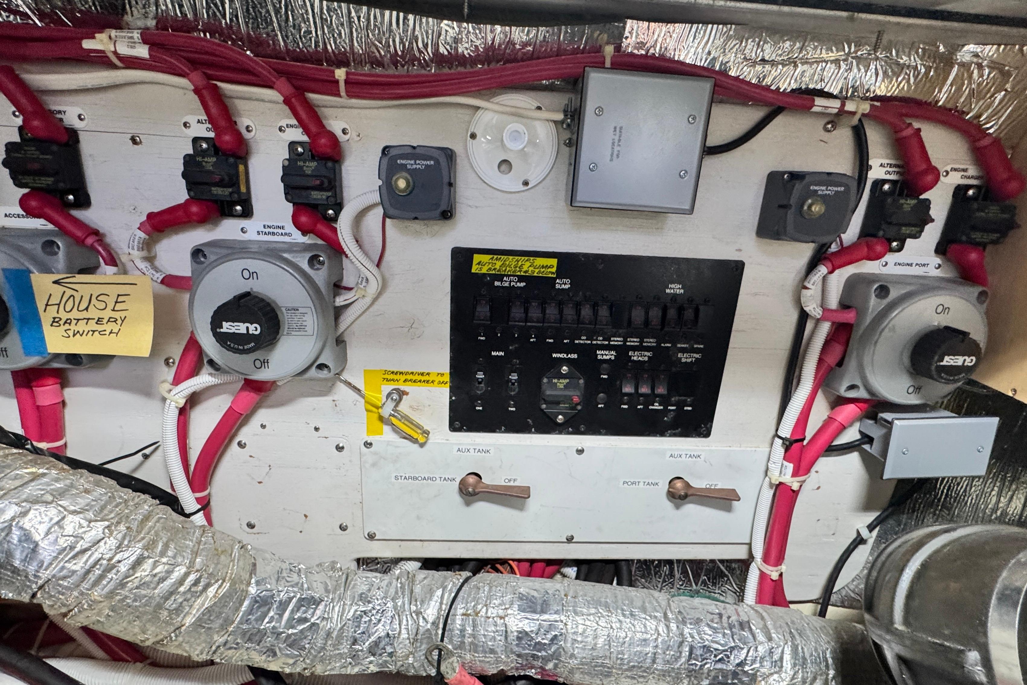 Electrical panel of a 2007 Carver 47 Motor Yacht with labeled switches and wiring.