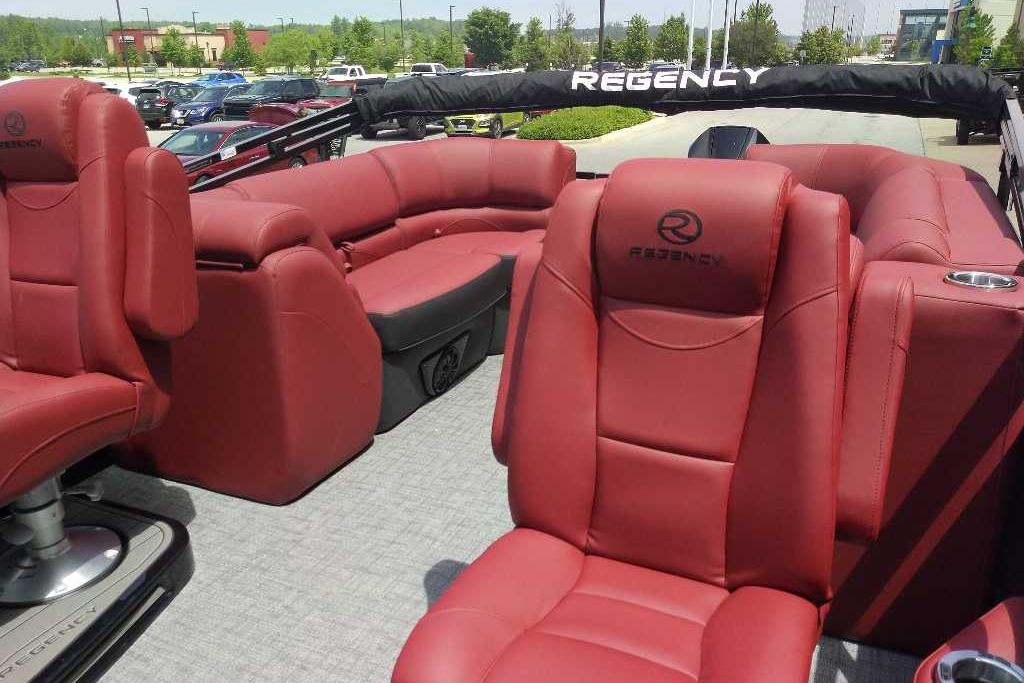 2026 Regency 230 DL boat interior with luxurious red seating and sleek design.